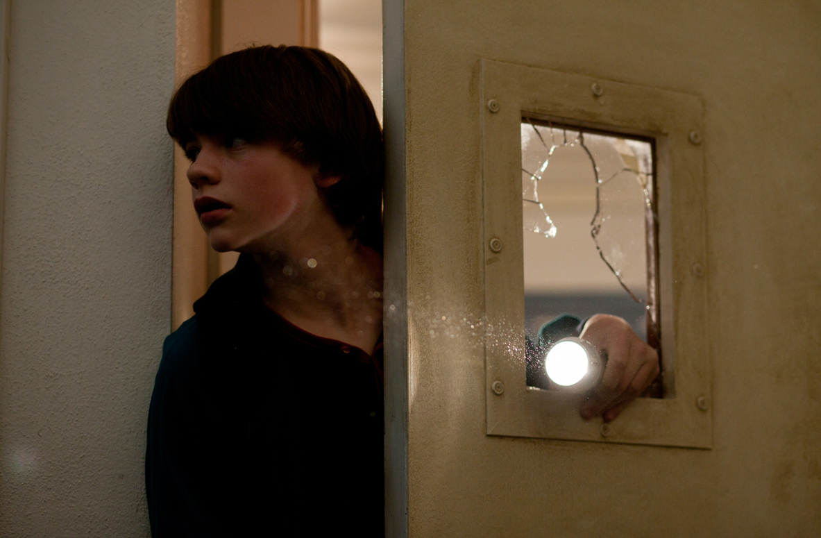 Joel Courtney in the still from the movie Super 8 Eight