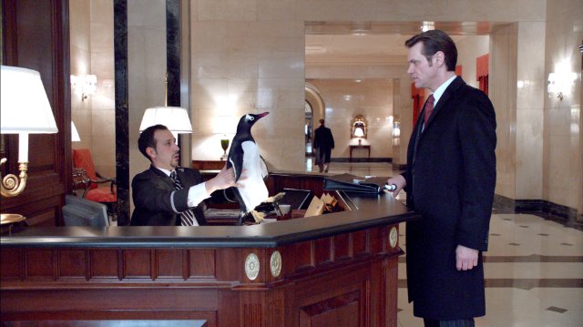 Jim Carrey, Desmin Borges in the still from the movie Mr. Poppers Penguins