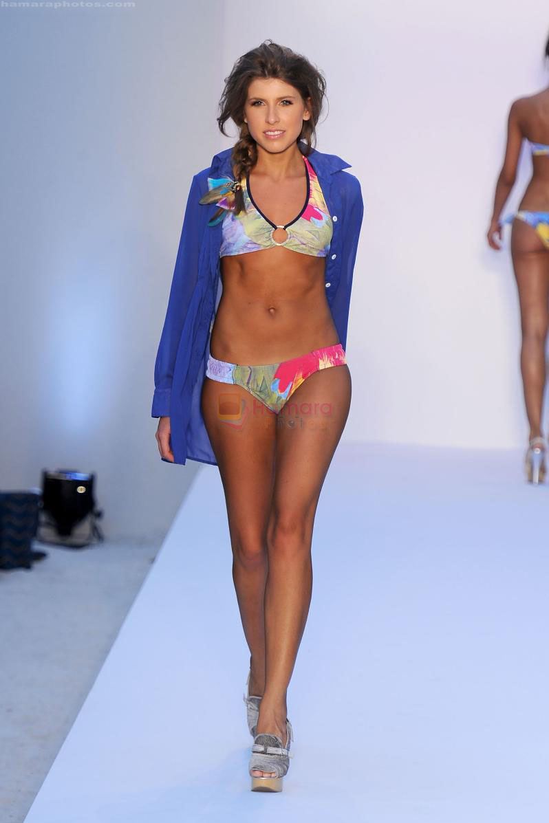A model walks the runway for the Poko Pano show during Mercedes-Benz Fashion Week Swim 2012 at The Raleigh on July 15, 2011 in Miami Beach, Florida