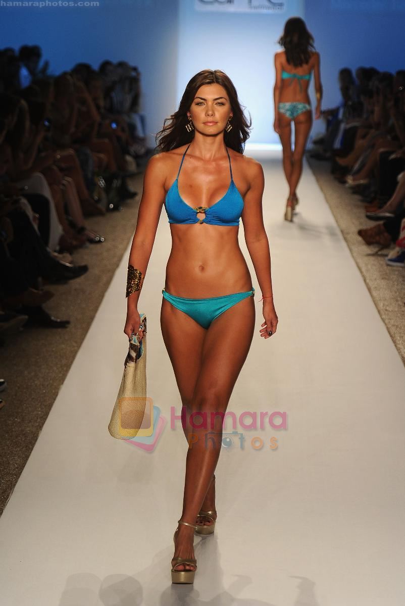 A model walks the runway for the Caffe Swimwear show during Mercedes-Benz Fashion Week Swim 2012 at The Raleigh on July 16, 2011 in Miami Beach, Florida