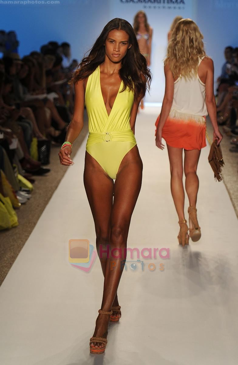 A model walks the runway during the Cia Maritima show at Mercedes-Benz Fashion Week Swim 2012 at The Raleigh on July 17, 2011 in Miami Beach, Florida