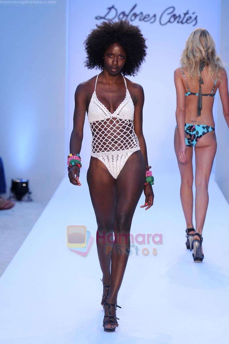 A model walks the runway at the Dolores Cortes swim show during Mercedes-Benz Fashion Week Swim 2012 at The Raleigh on July 16, 2011 in Miami Beach, Florida