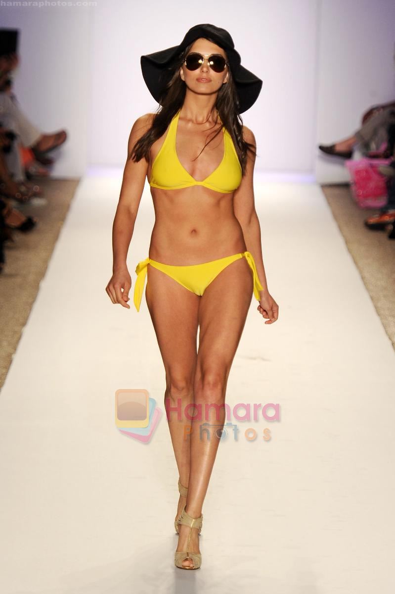 A model walks the runway at the Jogo Beach show during Merecedes-Benz Fashion Week Swim 2012 on July 18, 2011 in Miami Beach, United States