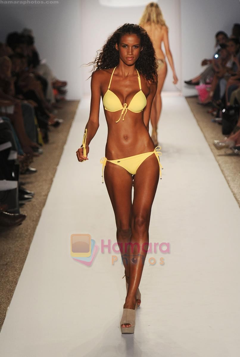 A model walks the runway at the Perfect Tan Bikini show during Merecedes-Benz Fashion Week Swim 2012 on July 18, 2011 in Miami Beach, United States
