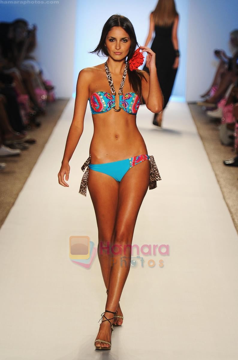 A model walks the runway at the Aguaclara show during Merecedes-Benz Fashion Week Swim 2012  on July 18, 2011 in Miami Beach, United States