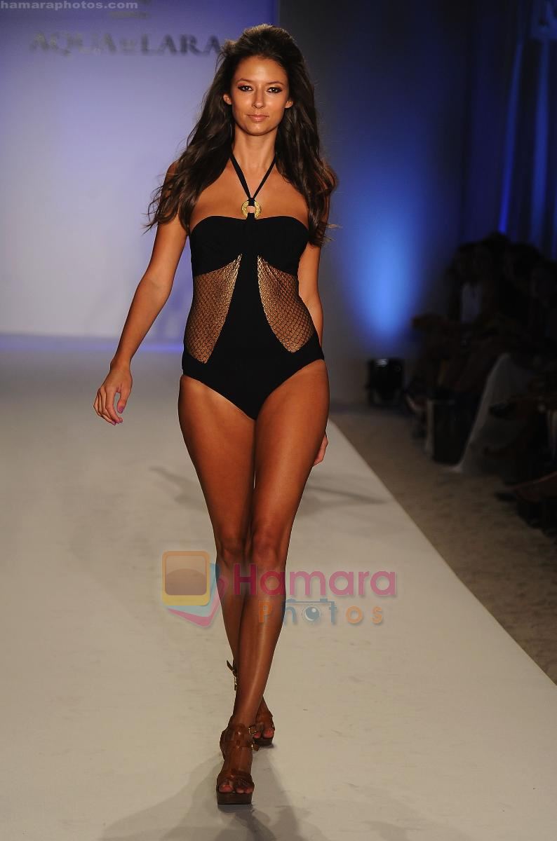 A model walks the runway at the Aqua Di Lara show during Mercedes-Benz Fashion Week Swim 2012 at The Raleigh on July 16, 2011 in Miami Beach, Florida.
