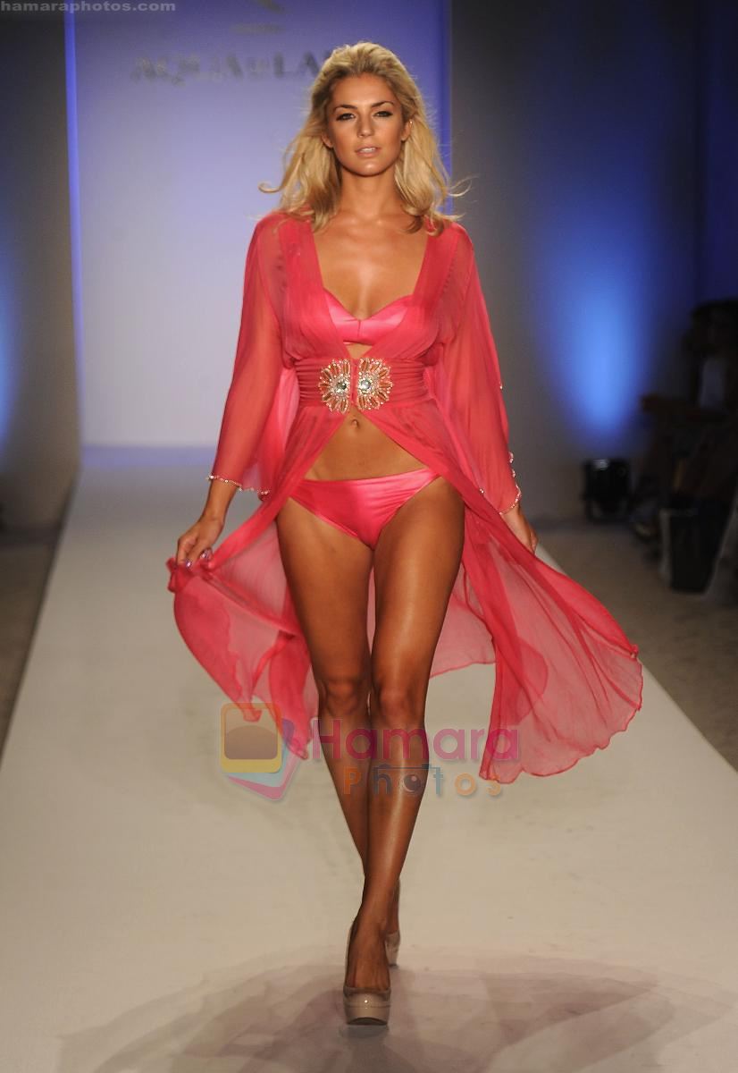 A model walks the runway at the Aqua Di Lara show during Mercedes-Benz Fashion Week Swim 2012 at The Raleigh on July 16, 2011 in Miami Beach, Florida.