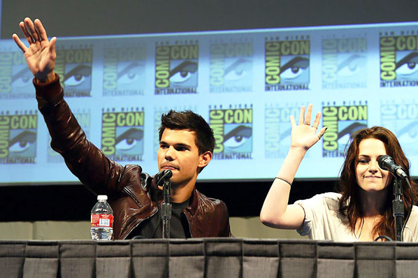Taylor Lautner, Kristen Stewart poses to promote Breaking Dawn from the Twilight Saga at  the 2011 Comic-Con International Day 1 at the San Diego Convention Center on July 21, 2011