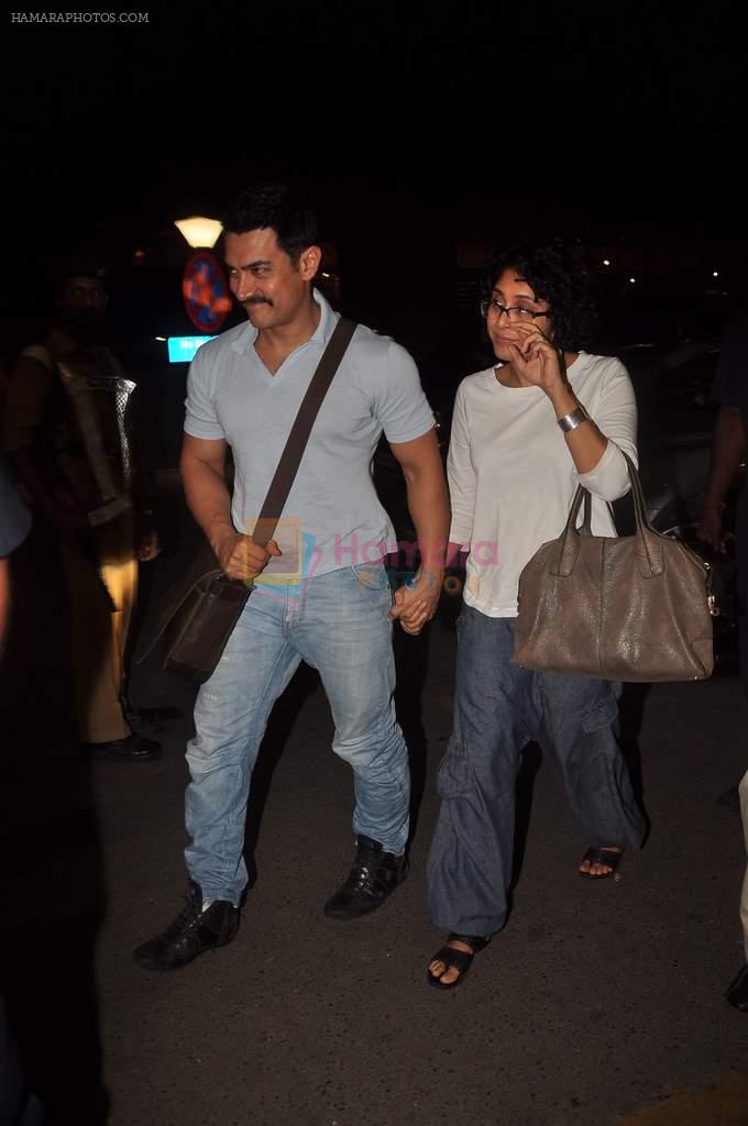 Aamir Khan, Kiran Rao snapped at airport on 27th Oct 2011