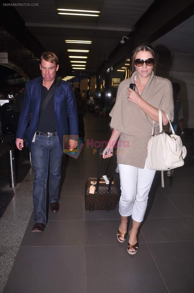 Liz Hurley snapped with Shane Warne at Mumbai airport on 1st June 2012
