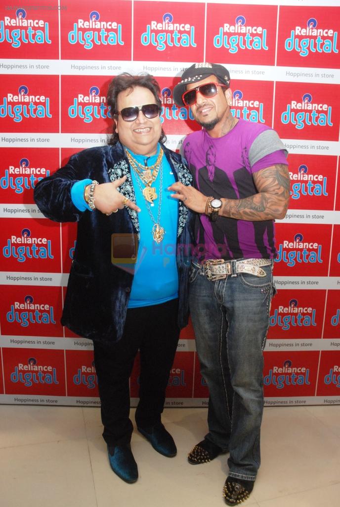 Bappi Lahiri and Jazzy B unveil The Holi War at Reliance Digital store in Mumbai on 20th March 2013