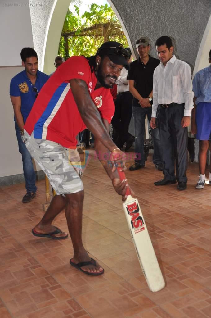 Chris Gayle and Siddharth Mallya spend time with NGO kids in Worli, Mumbai on 26th April 2013