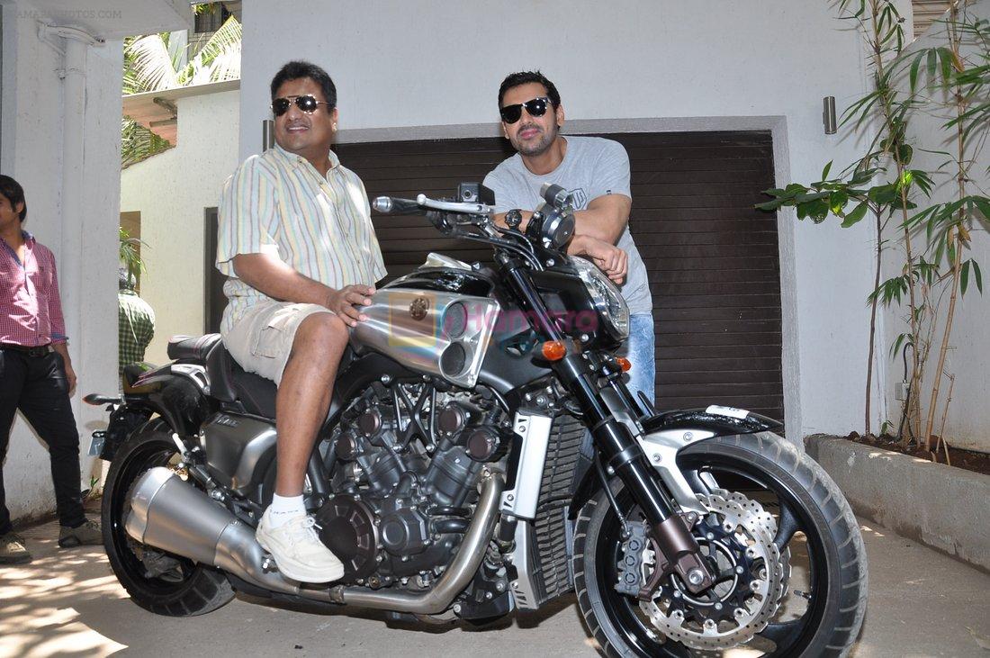 John Abraham gifts his favourite bike to Sanjay Gupta in Bandra, Mumbai on 7th May 2013