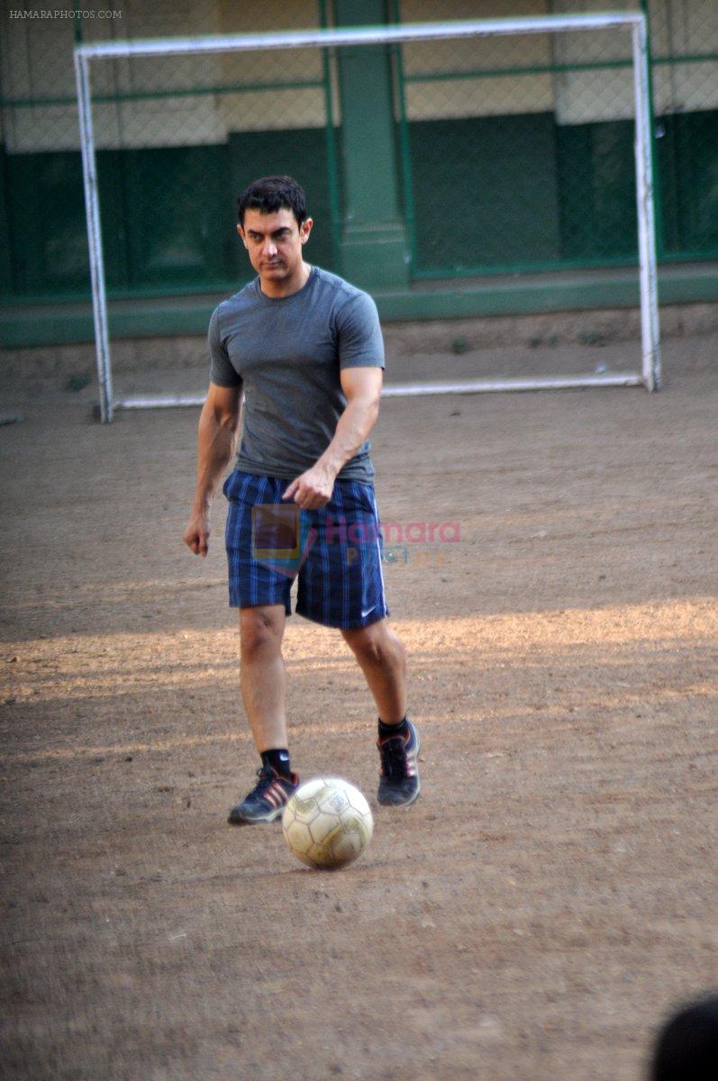 Aamir Khan snapped playing football with Daughter Ira in Bandra, Mumbai on 8th May 2013