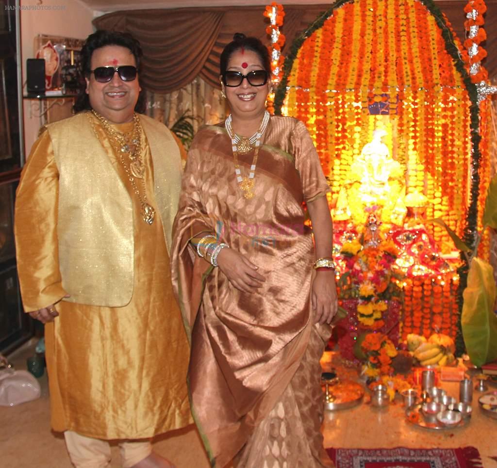 Bappi Lahiri and Chitrani Lahiri at Bappi Lahiri's Ganpati celebrations in Mumbai on 9th Sept 2013