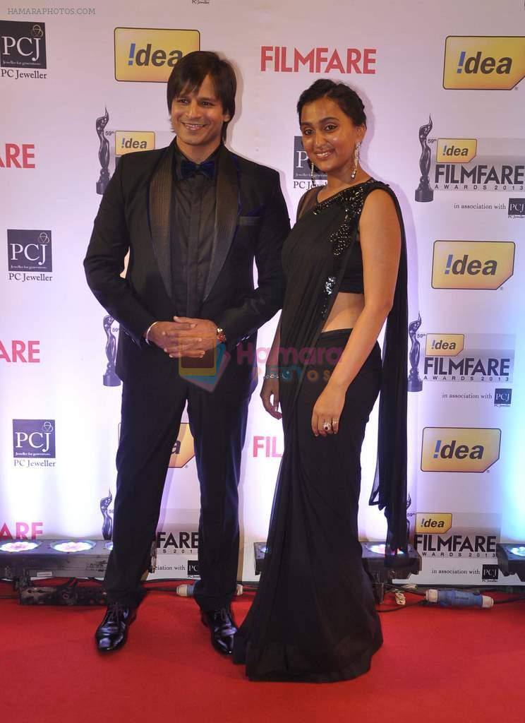 Vivek Oberoi with wife walked the Red Carpet at the 59th Idea Filmfare Awards 2013 at Yash Raj