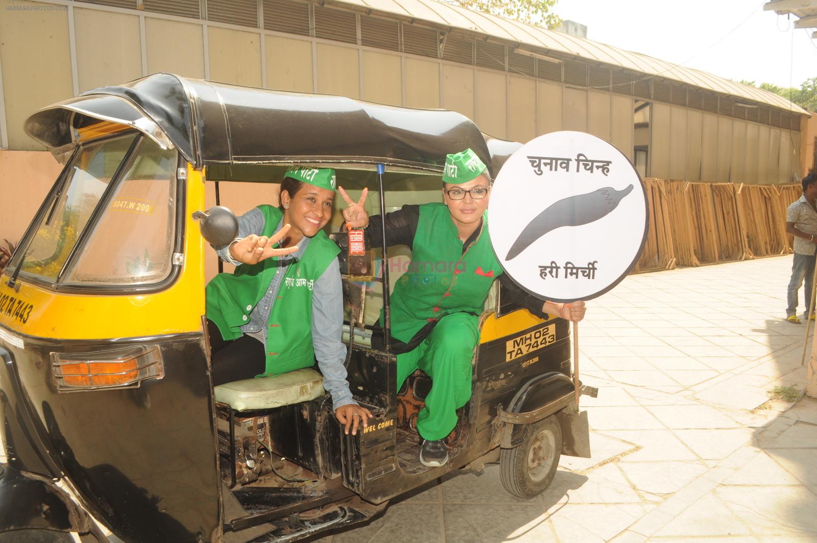 Rakhi sawant follows her manifesto and drives around town with women autorickshaw driver in Mumbai on 20th April 2014