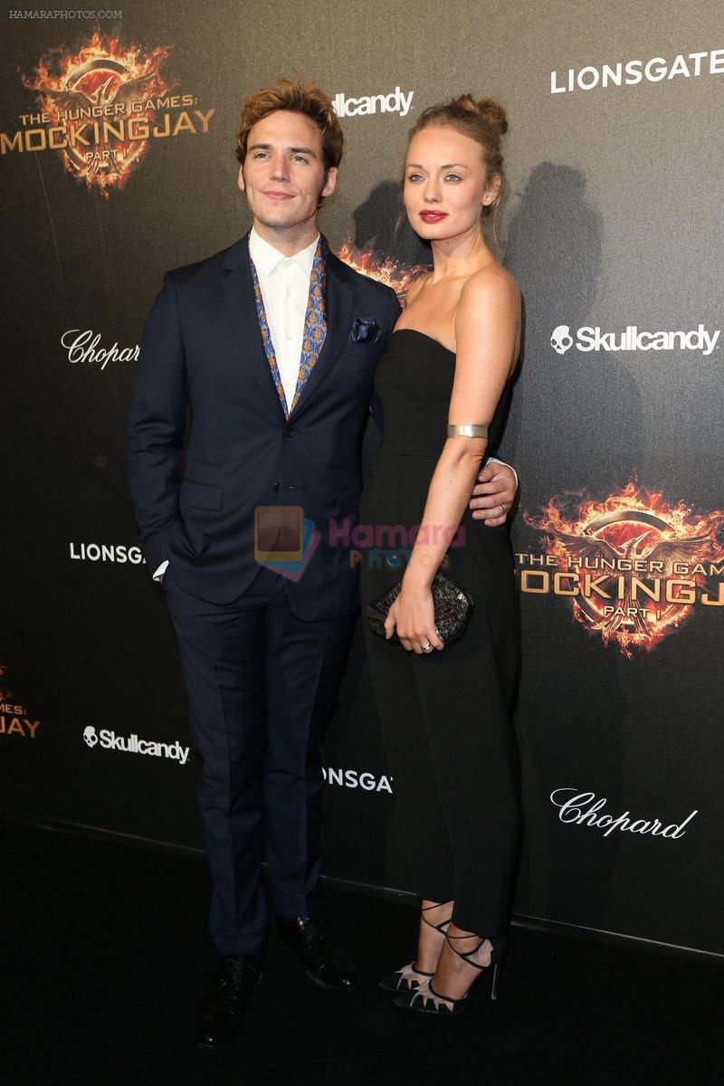 0517_Claflin_Haddock_at_Hunger-Games_party_with_Chopard_