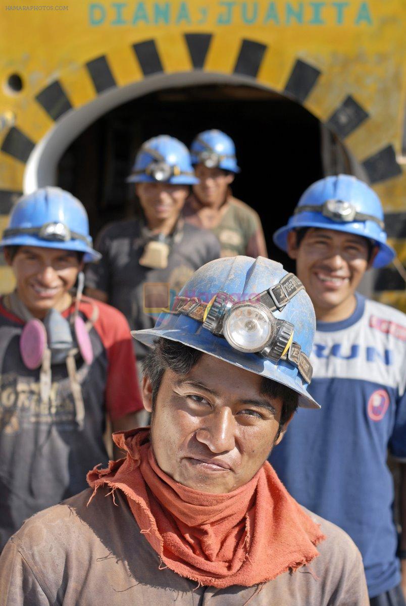 Group_of_miners_outside'shaft_Faith_and_Hapiness