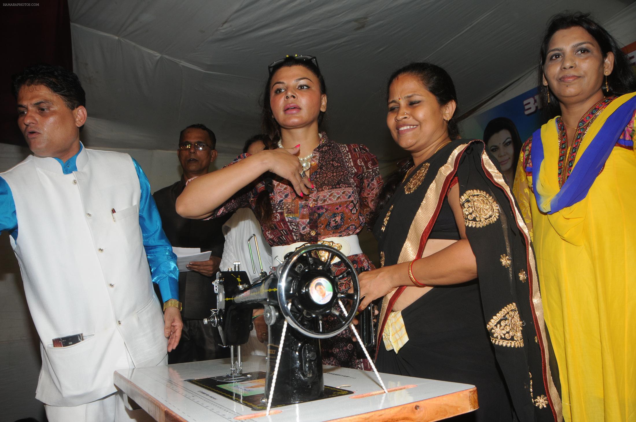 Cyril Dsouza with Rakhi Sawantand Zeenat Qureshi  Distributing Sewing Machines