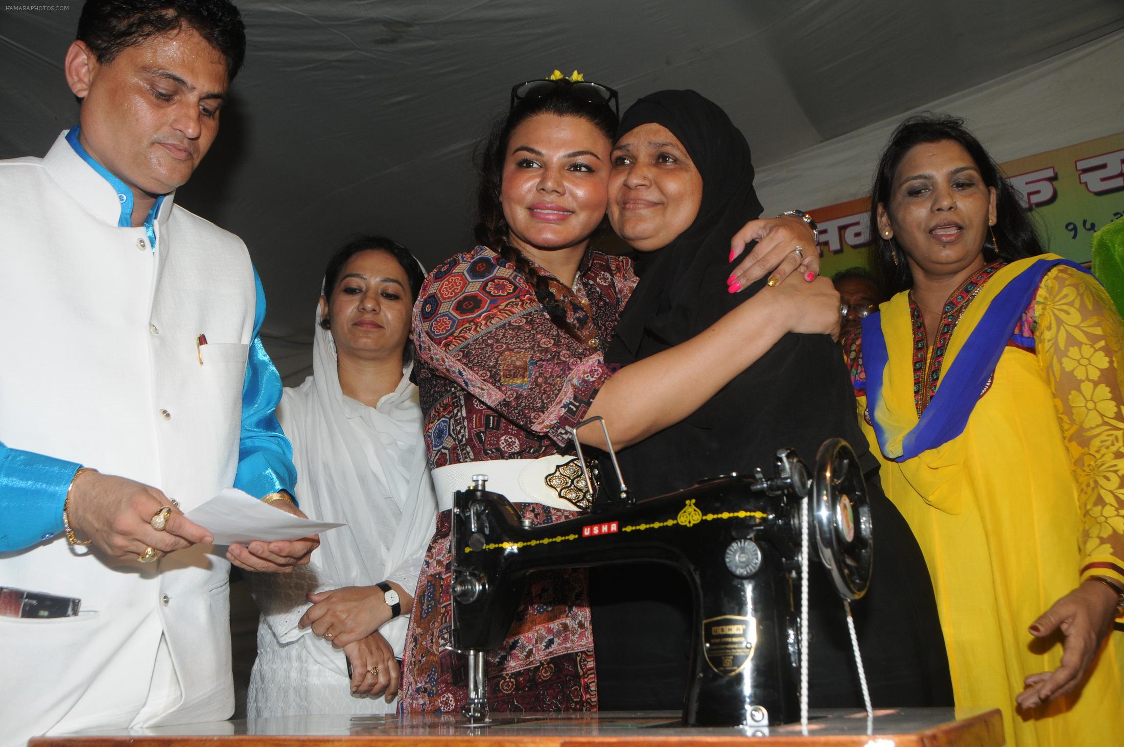 Cyril Dsouza with Rakhi Sawantand Zeenat Qureshi  Distributing Sewing Machines