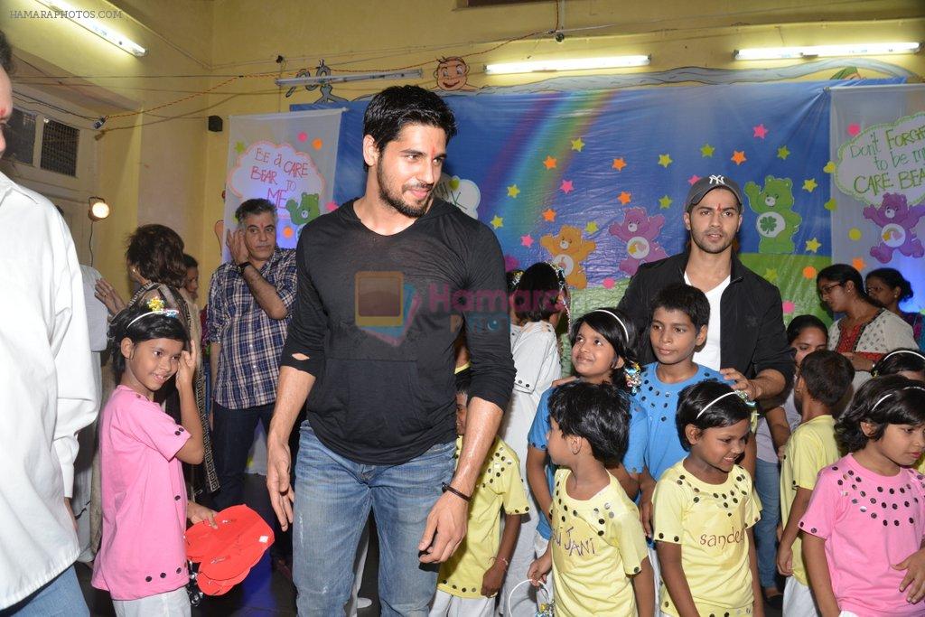 Varun Dhawan, Sidharth Malhotra interact with kids of Ashray NGO and Abu Jani, Sandeep Kosla charity in Bandra, Mumbai on 23rd Aug 2014