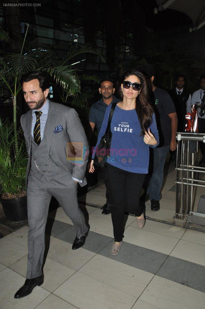 Saif Ali Khan, Kareena Kapoor snapped back from Delhi on 26th Oct 2014