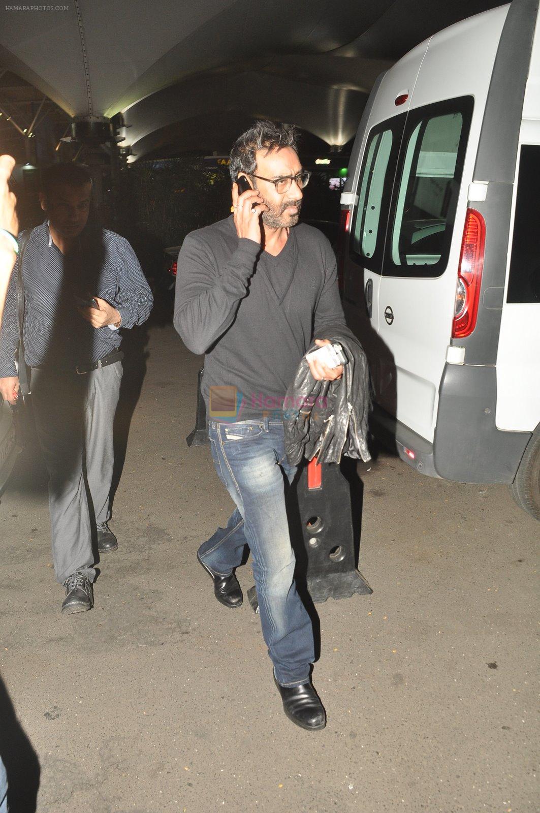 Ajay devgan snapped at airport in Mumbai on 12th Dec 2014