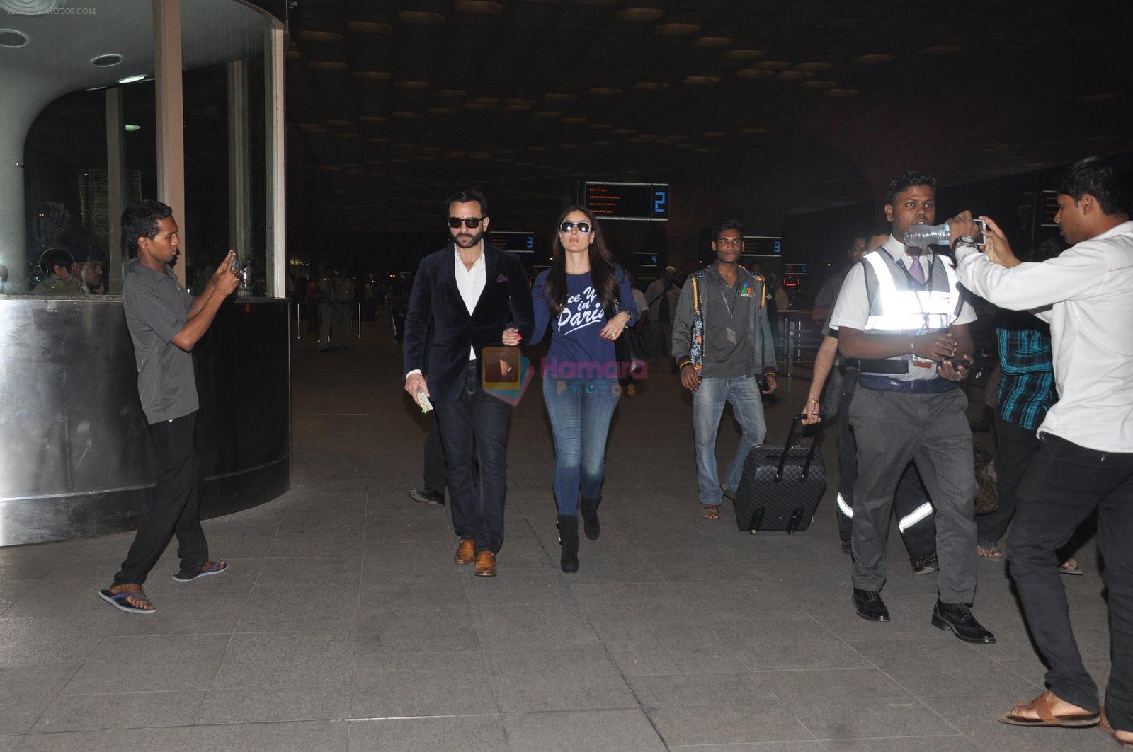 Kareena Kapoor and Saif Ali Khan snapped at airport on 25th Dec 2014