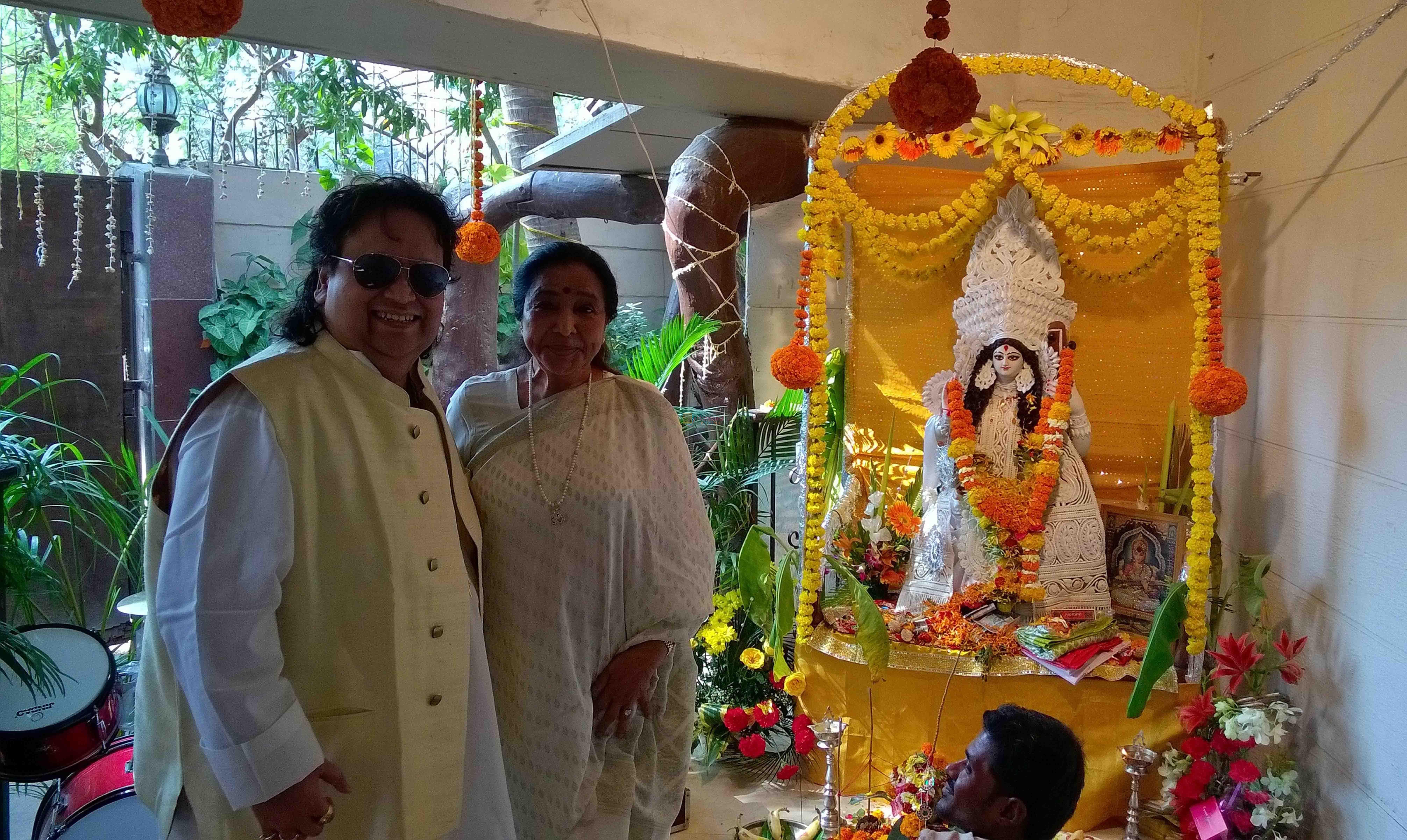 Bappi Lahiri and Asha Bhosle at Bappi Lahiri's Saraswati Puja
