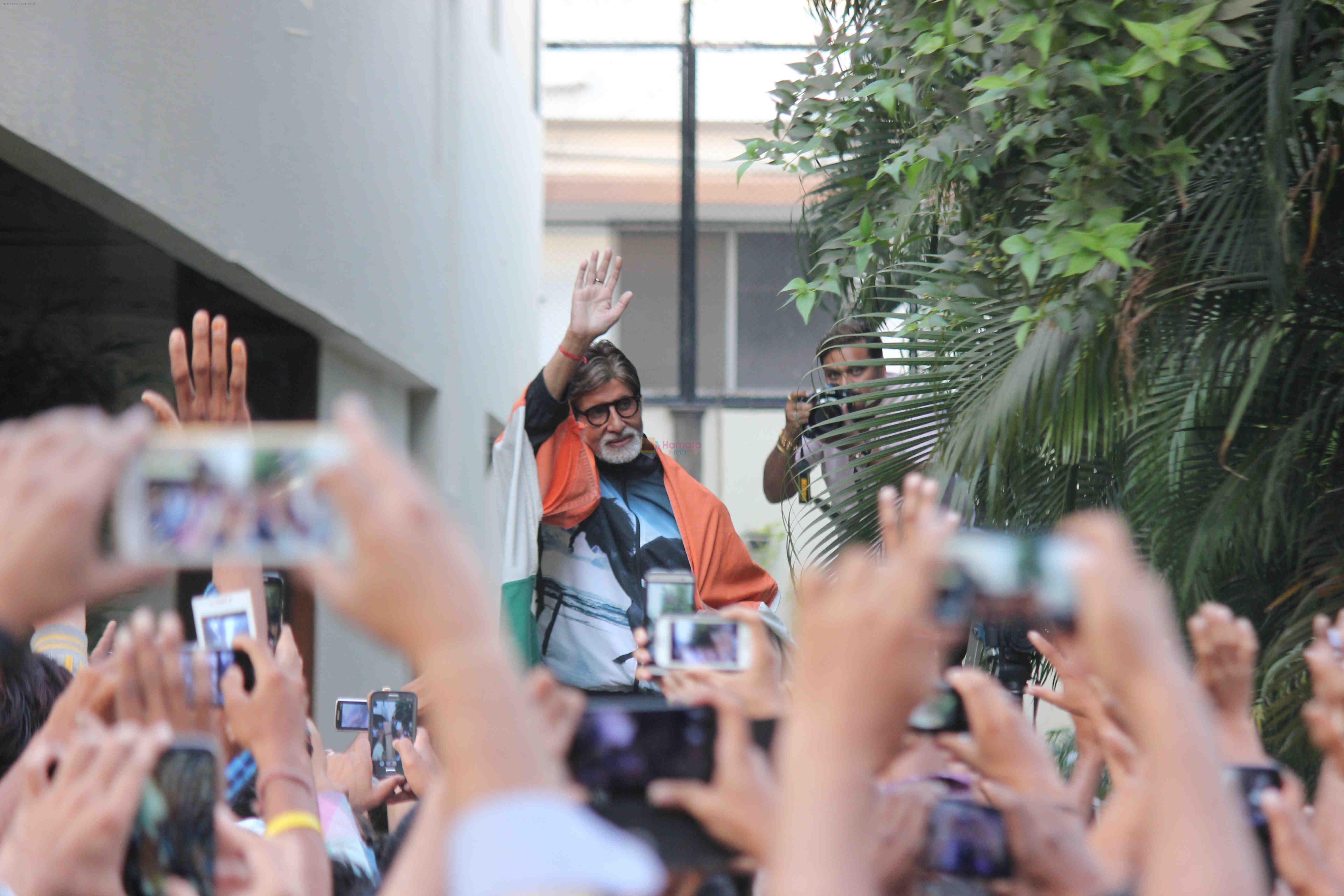 Amitabh Bachchan celebrates with fans India's world cup win over Pakistan at his residence Jalsa in Mumbai on 15th Feb 2015