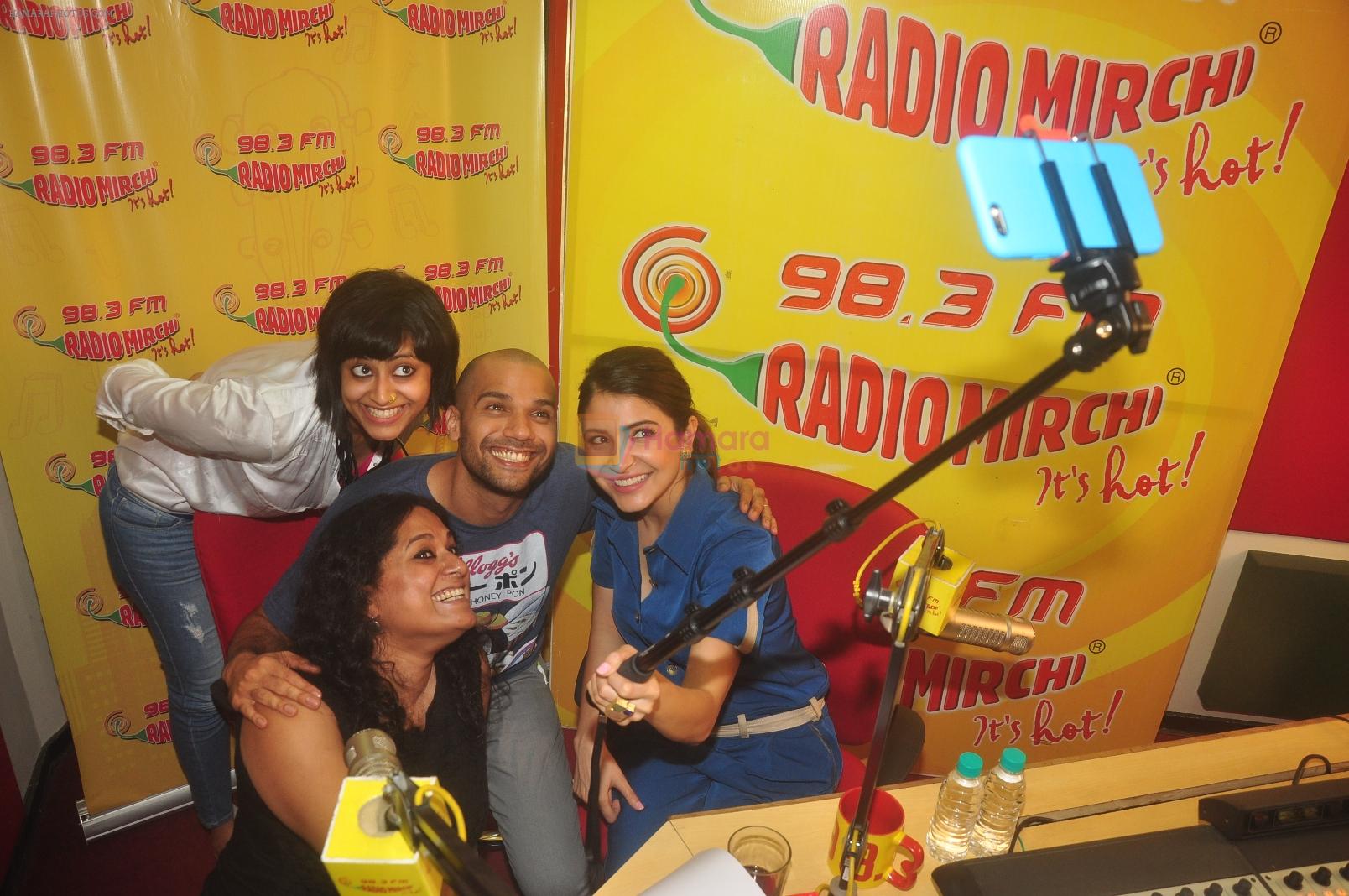 Anushka Sharma and Neil Bhoopalam with RJ Prackriti and RJ Sangeeta taking a selfie at Radio Mirchi studio