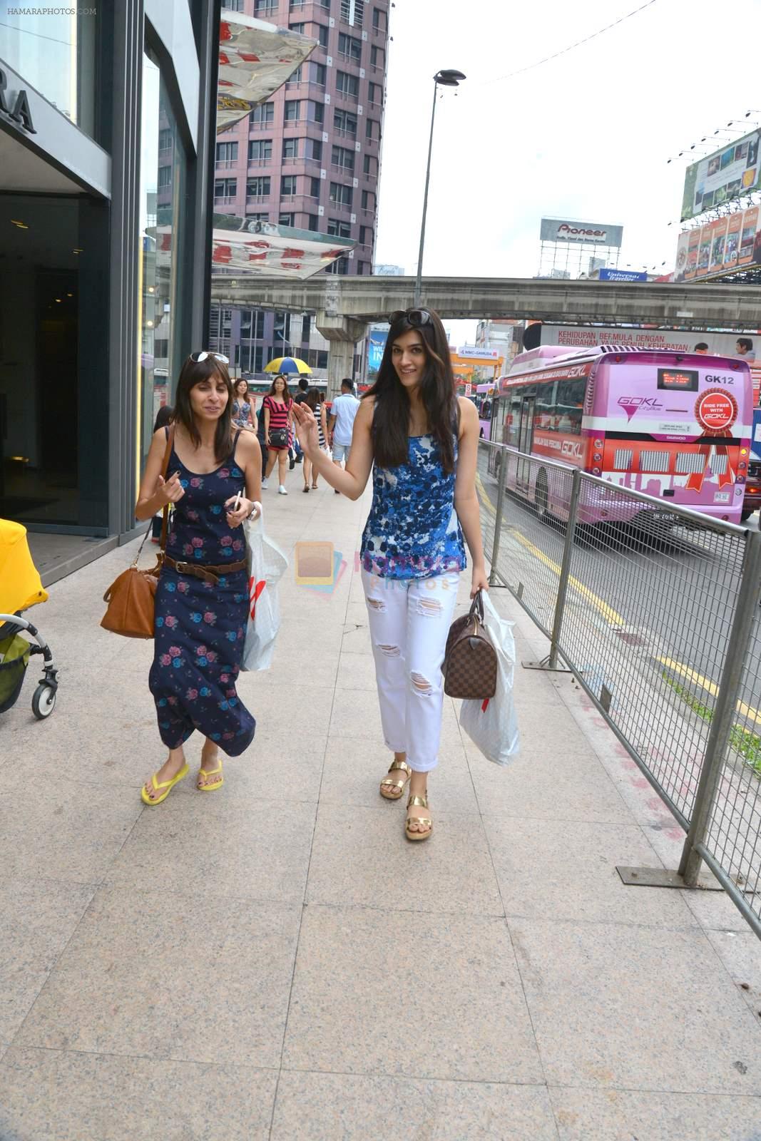 Kriti Sanon snapped shopping with a friend without any security guards on the streets of Kuala Lampur on 11th June 2015