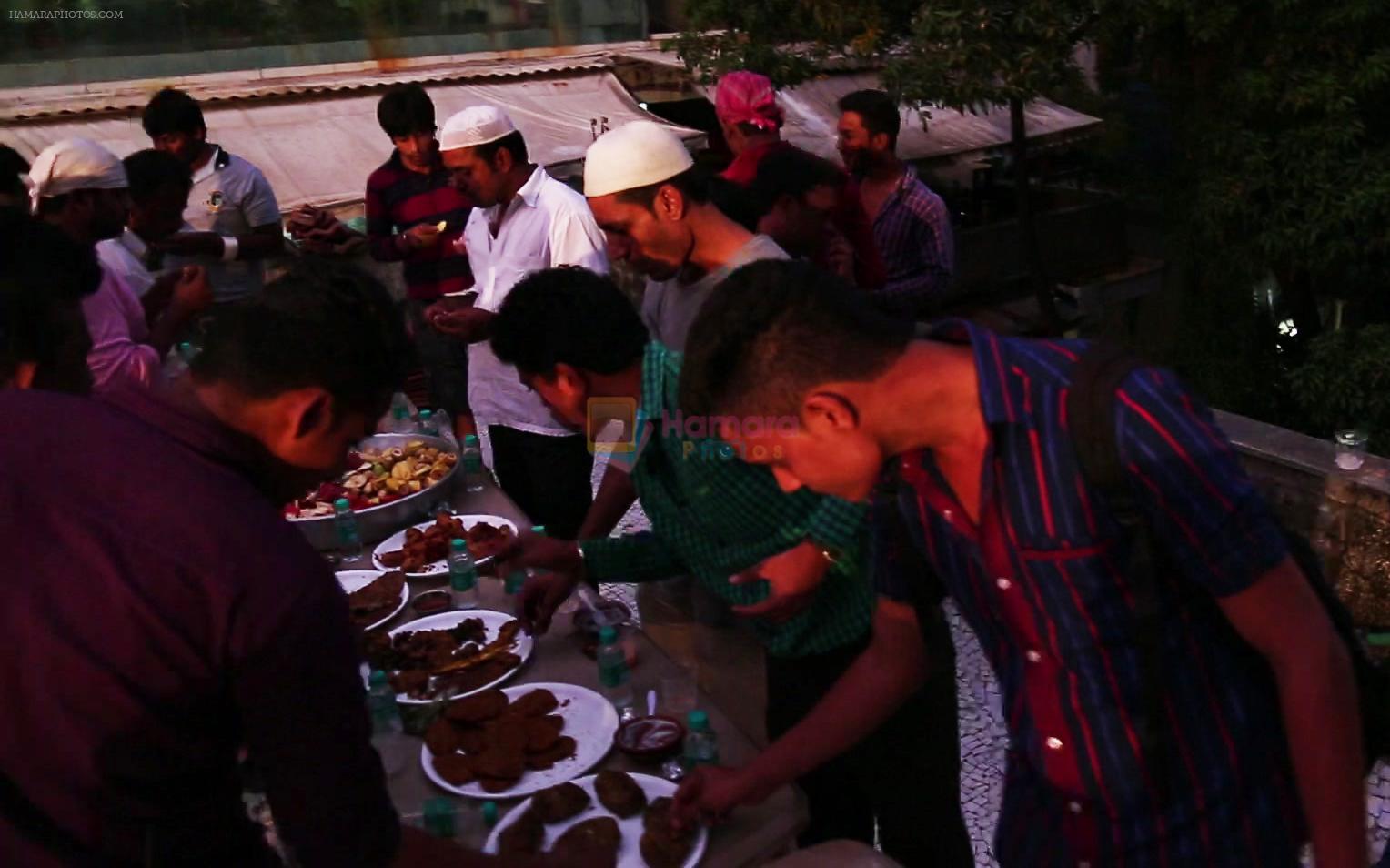 Crew members at Iftaar party during the shoot of Surani Pictures  _Chalk N Duster_.