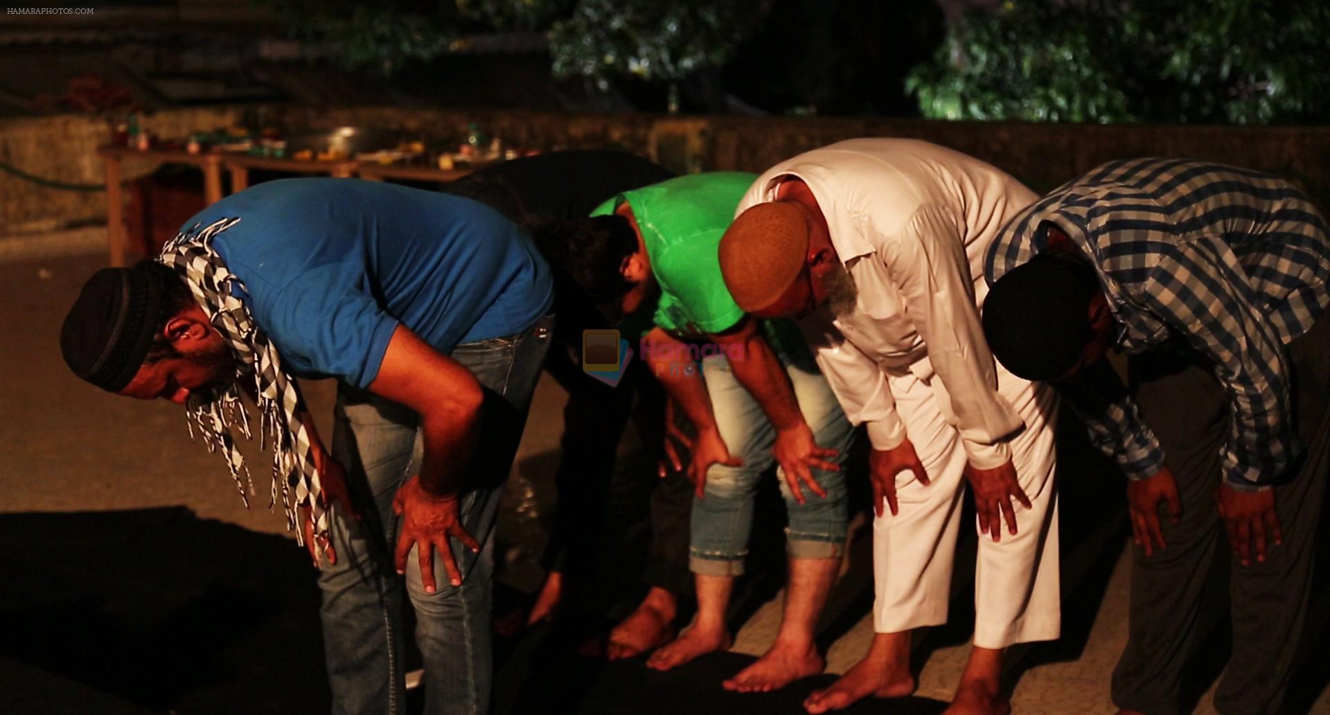 Crew members doing prayer before Iftaar party during the shoot of Surani Pictures  _Chalk N Duster_.1
