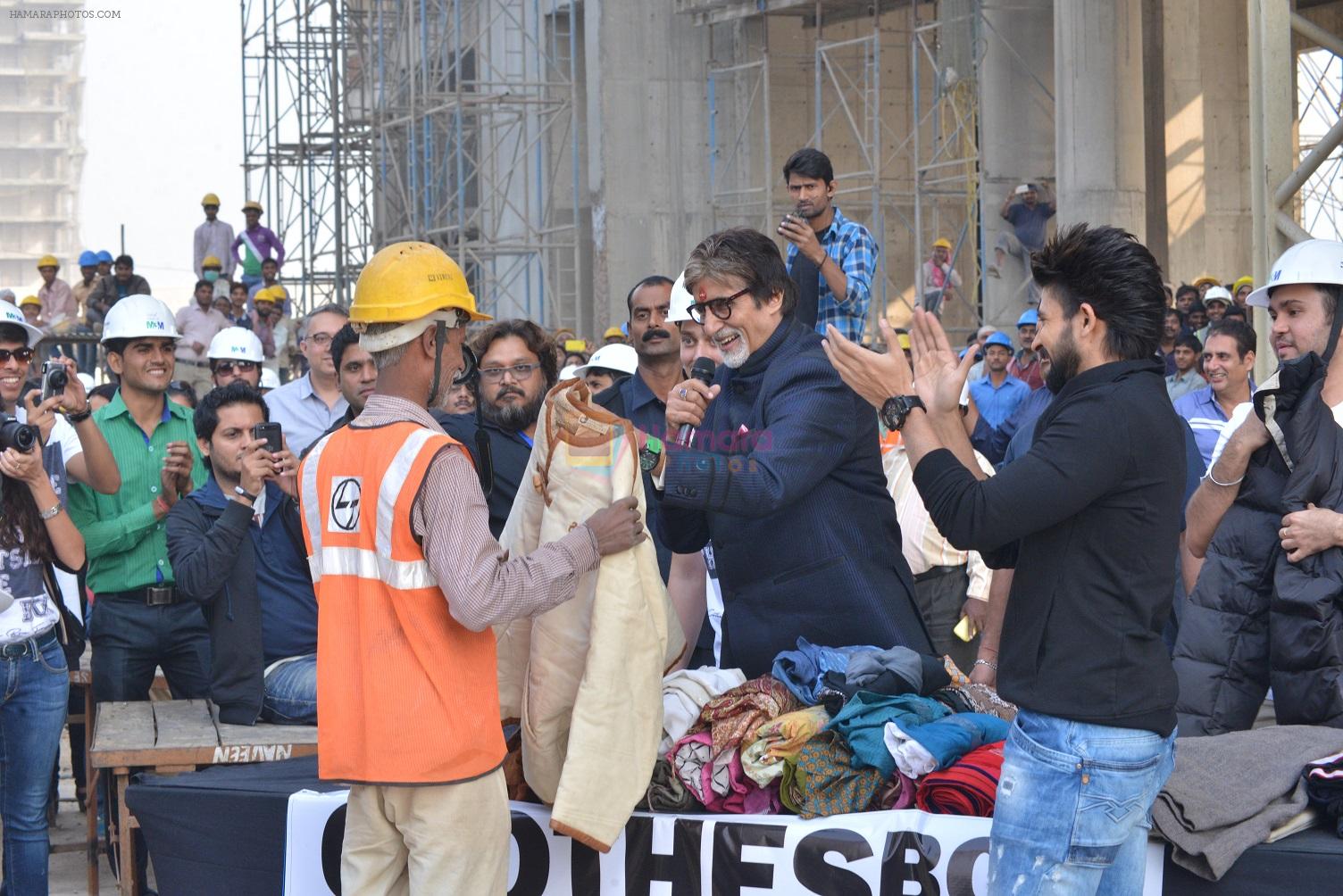 Amitabh Bachchan donating clothes at Gurgaon construction site for Clothes Box Foundation donation