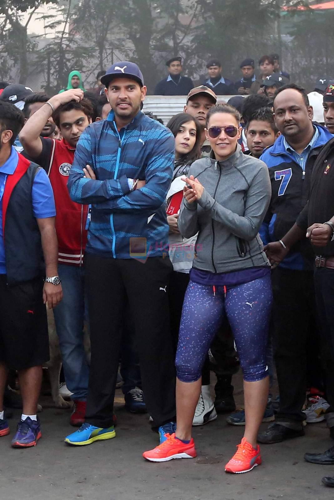 Neha Dhupia and Yuvraj Singh in Kolkatta for a marathon on 22nd Dec 2015