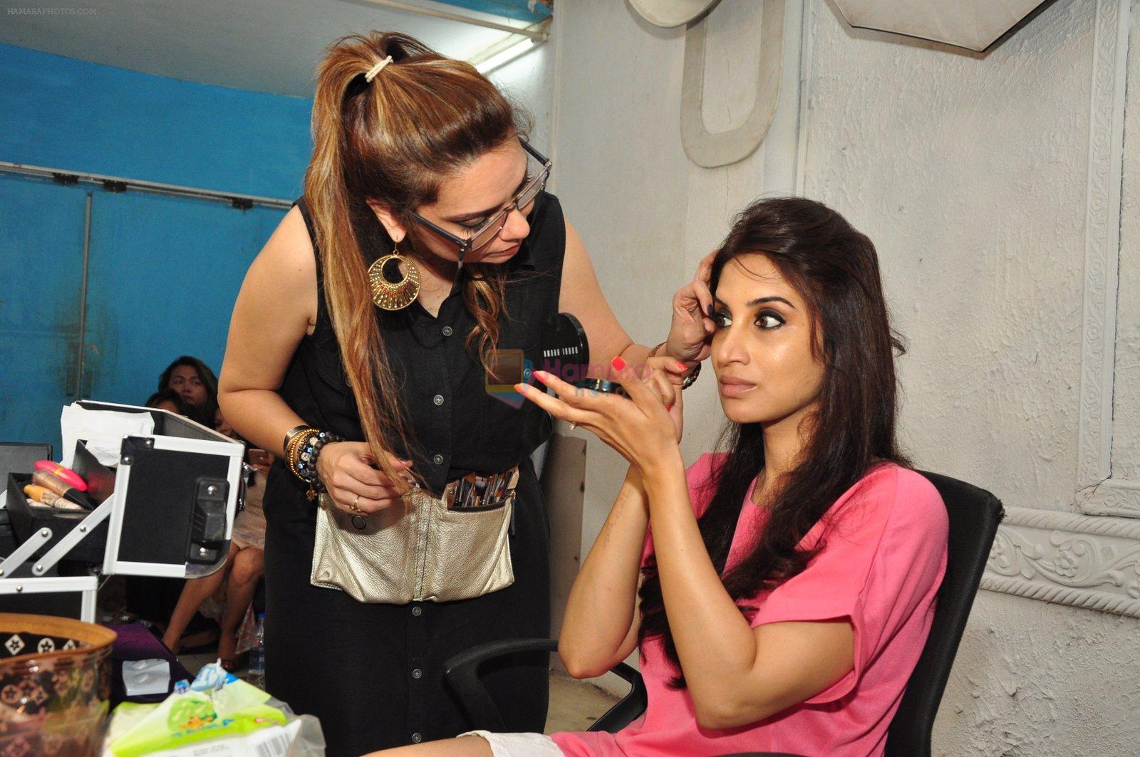 Marathi film actor Smita Gondkar with makeup artist Pinky Asnani during the monsoon make-up at PAMs salon, in Mumbai, India on June 24, 2016
