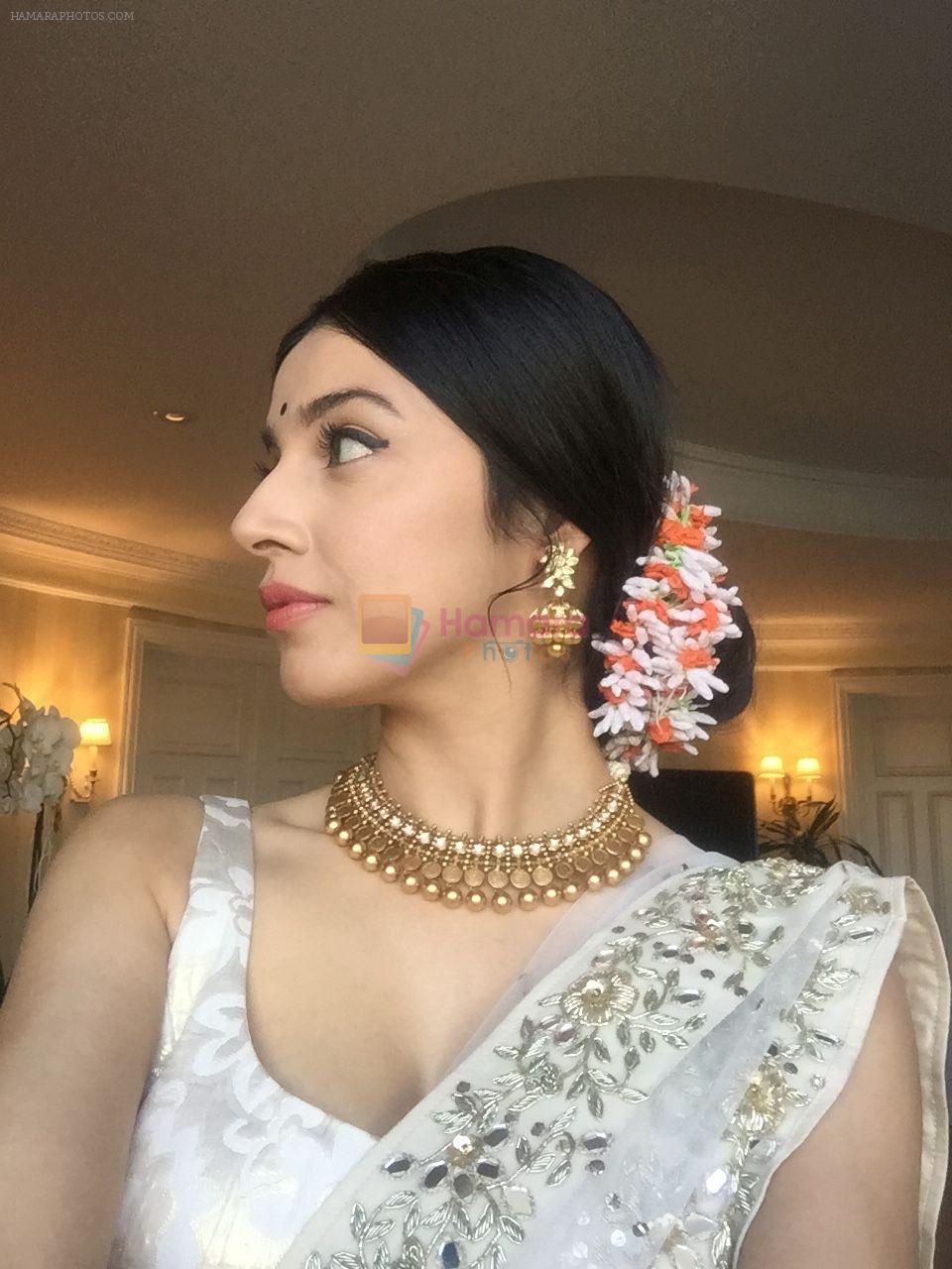 Divya Khosla  Spotted wearing a gorgeous cream lehenga by ace designer Vikram Phadnis and Jewellery by Shobha Shringar