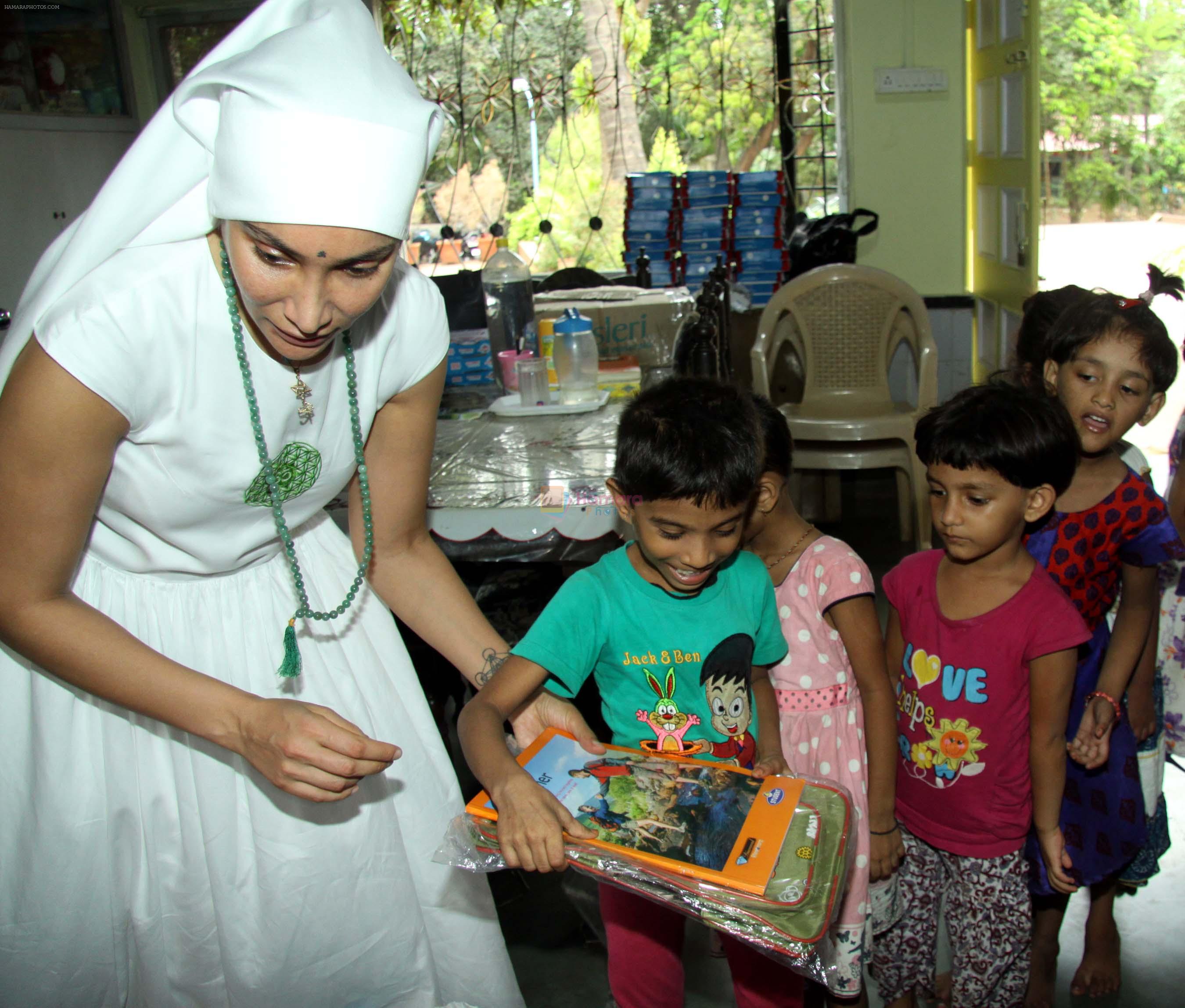 Gaia Mother Sofia distributed note books,bags to 140 girls of Bal Bhawan NGO at Andheri on 4th July 2016