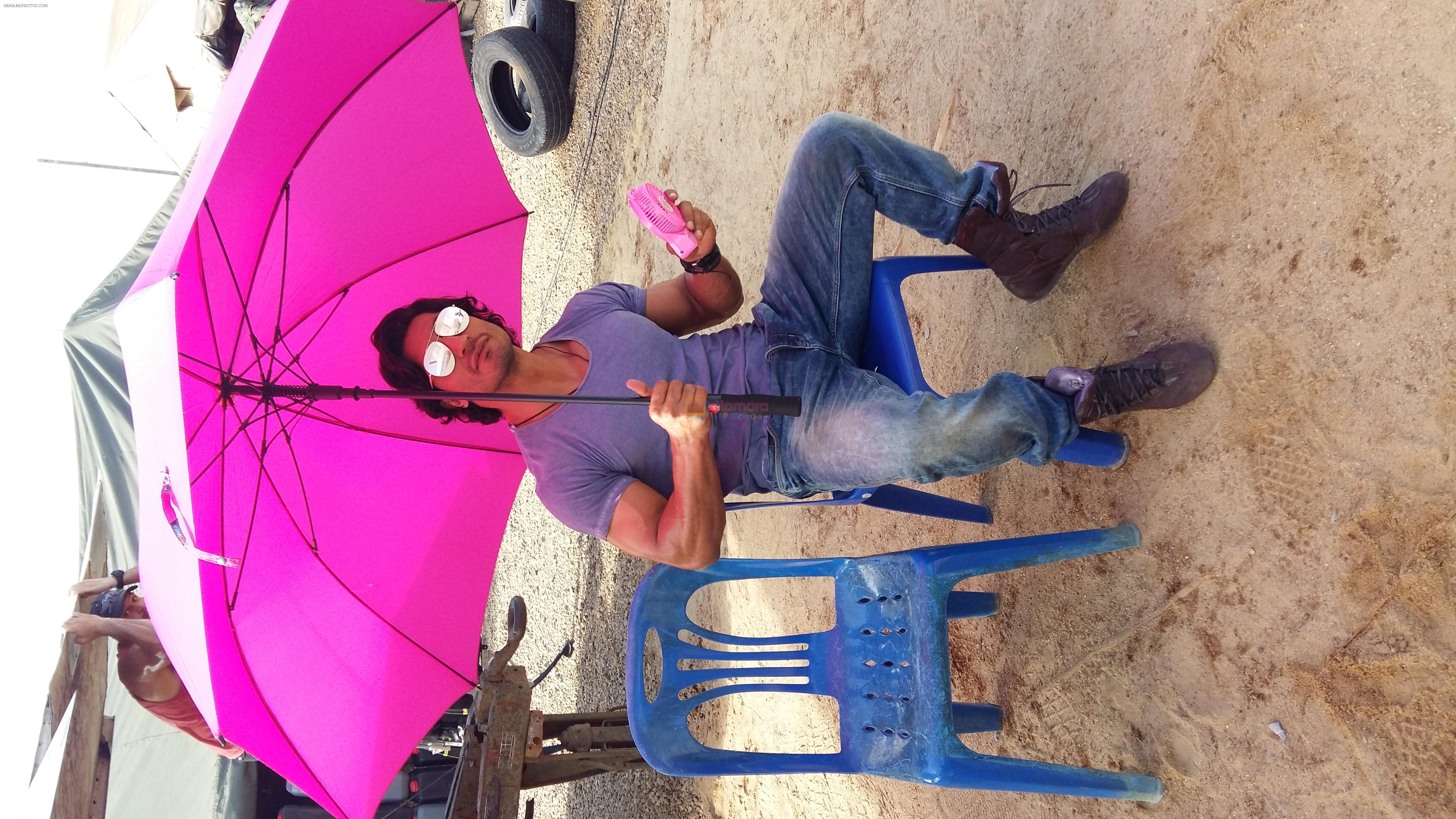 Vidyut Jammwal with a pink fan and umbrella on the sets of Commando 2 clicked by his Co star Adah sharma