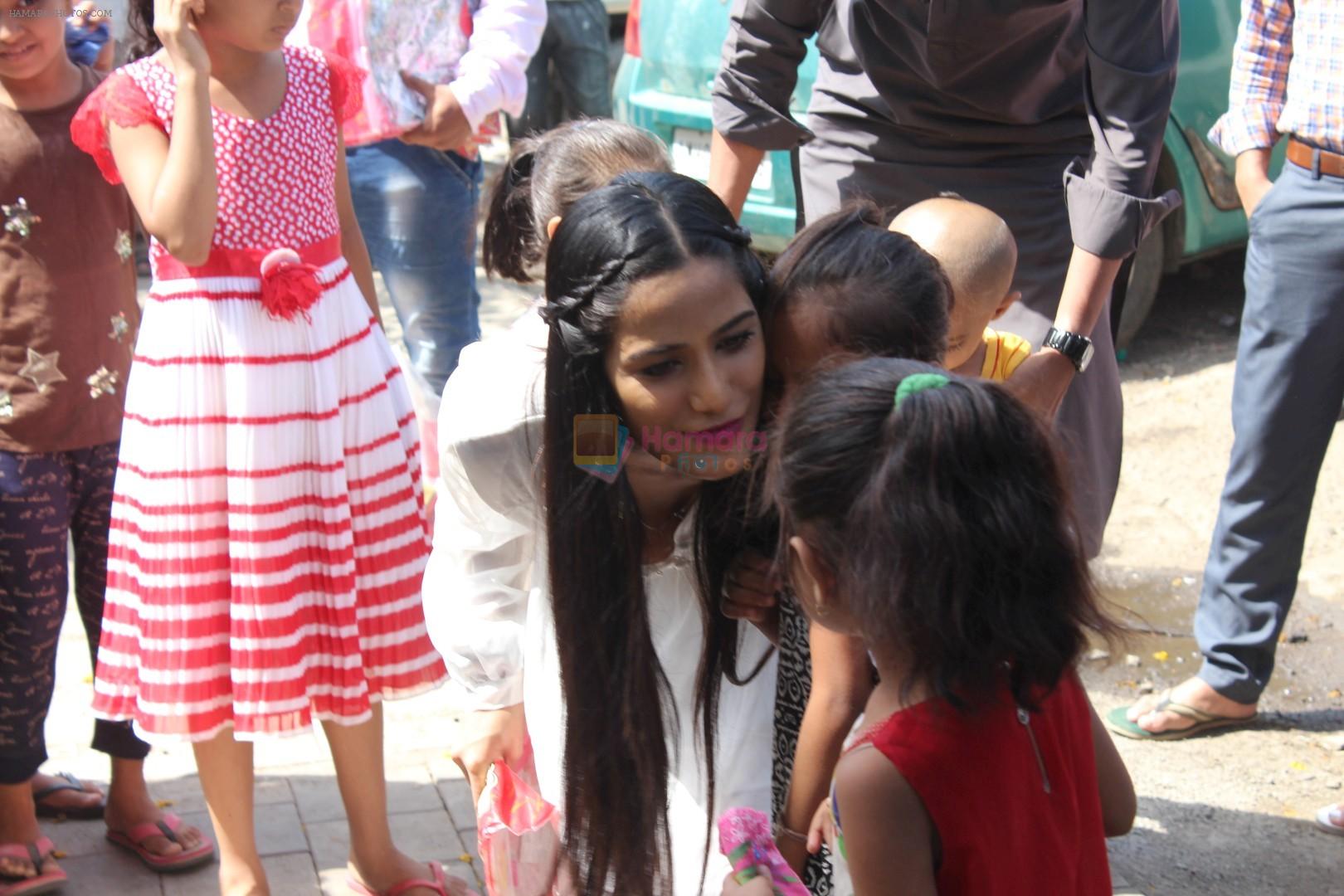 Poonam Pandey Distribute Raincoat To Neddy Kids on 30th May 2017