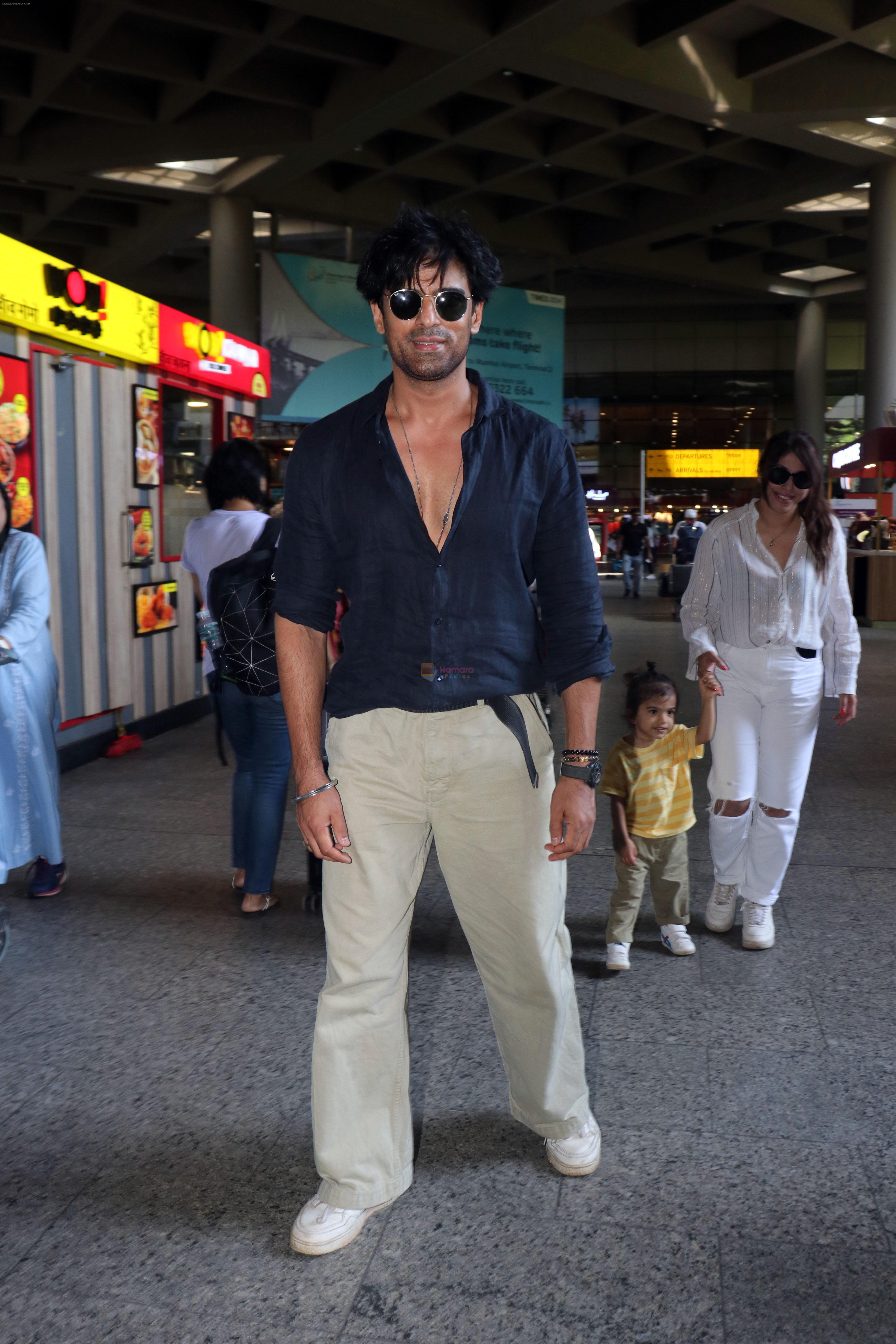 Mohit Malik, Addite Malik along with their child at the aiport on 20th May 2023