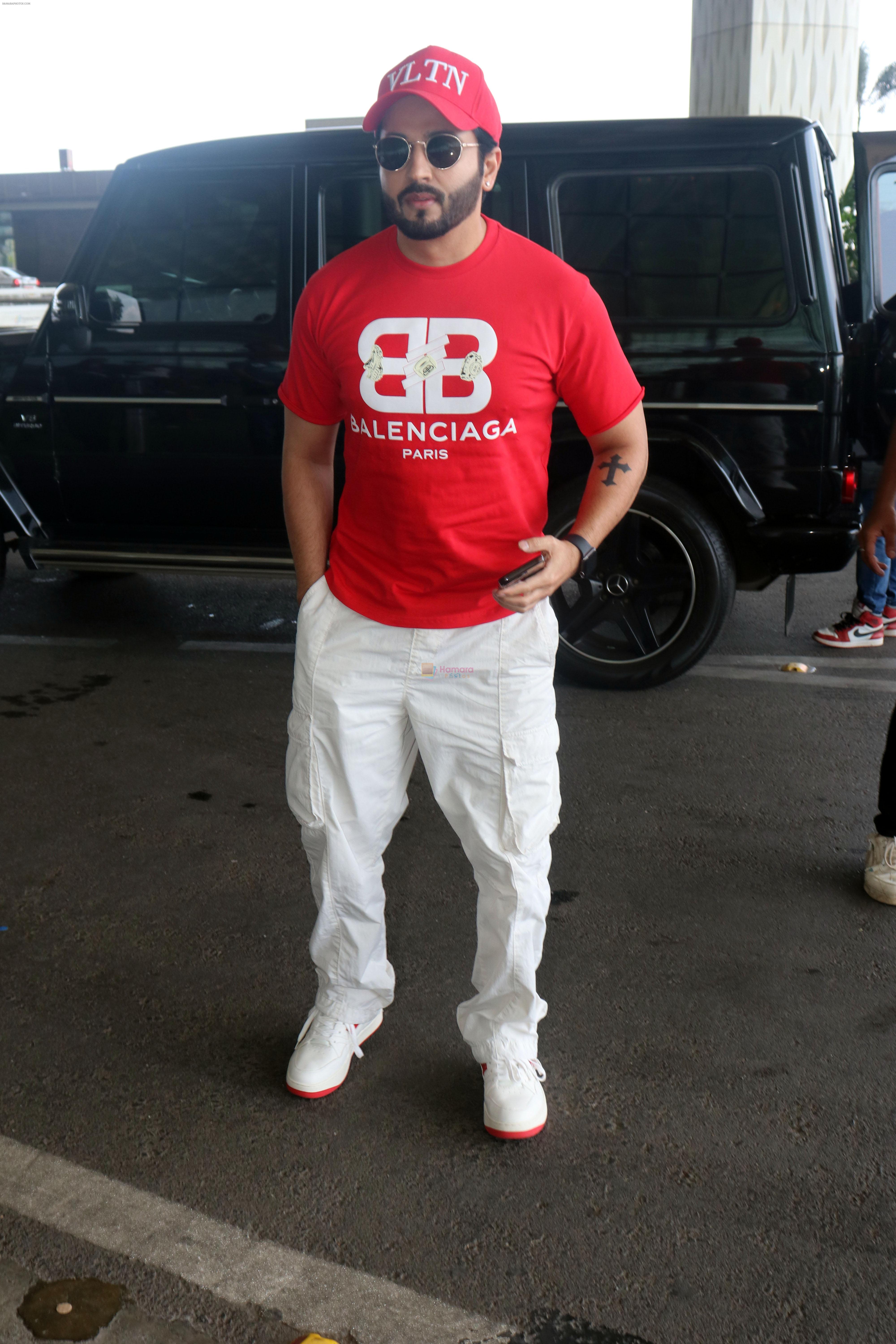 Dheeraj Dhoopar wearing VLTN Cap Balenciaga Paris T-Shirt White Pants and Shoes with red sole on 24 May 2023