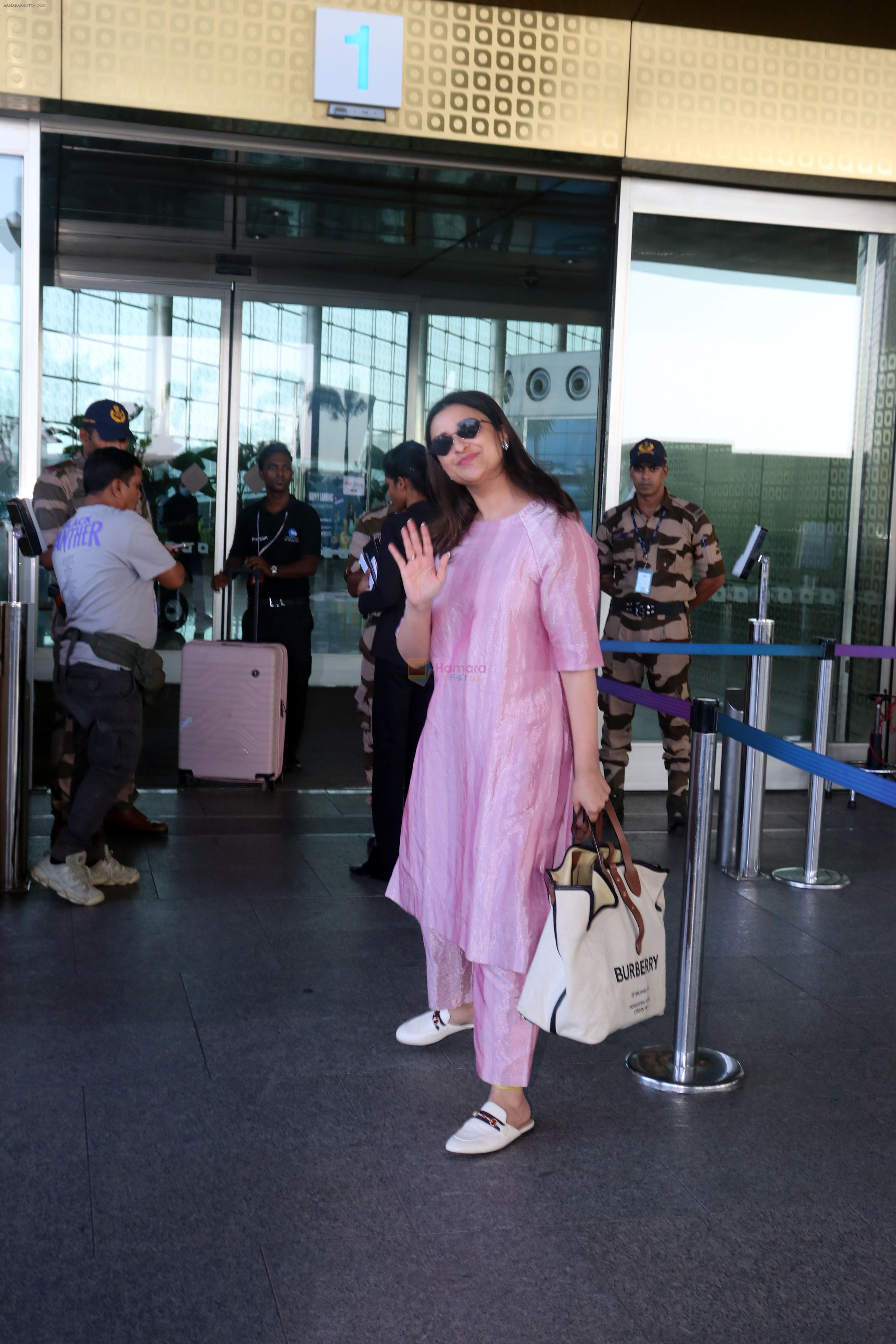 Parineeti Chopra wearing a bright pink dress white shoes sunglasses Burberry Horseferry Print Canvas leather handbag