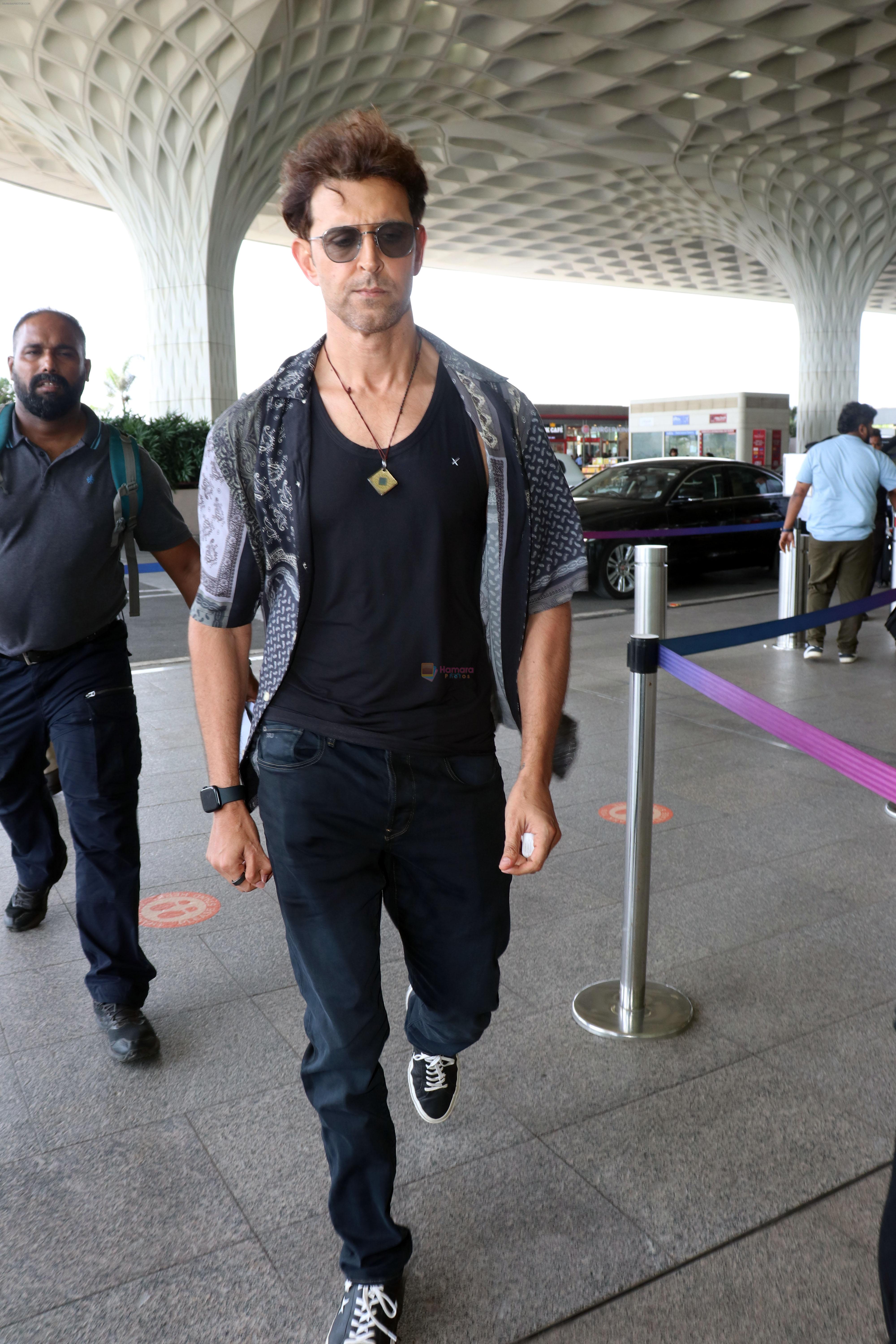 Hrithik Roshan in black teas unbuttoned shirt dark blue jeans and Converse Cons One Star Pro OX Shoes