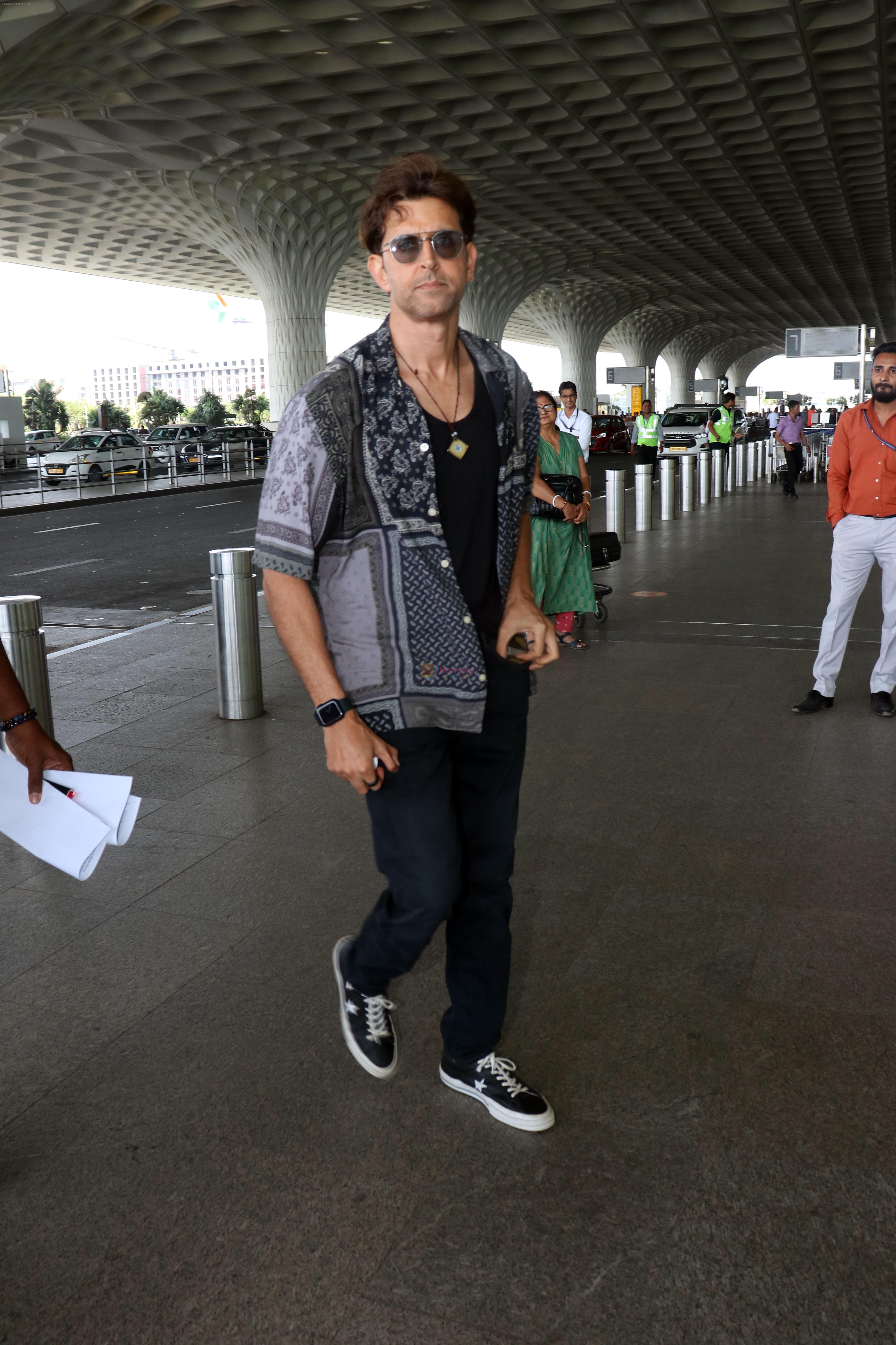 Hrithik Roshan in black teas unbuttoned shirt dark blue jeans and Converse Cons One Star Pro OX Shoes