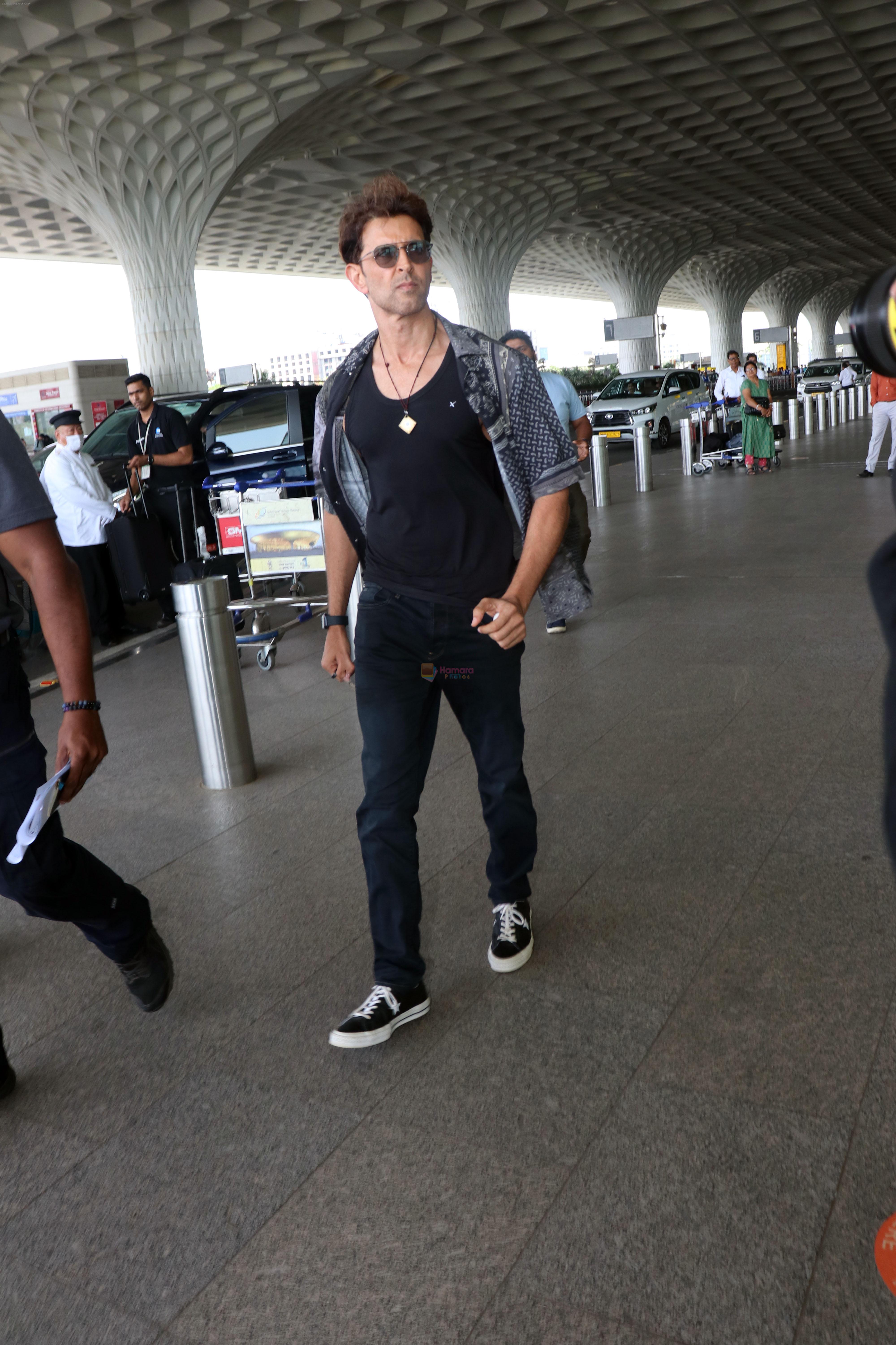 Hrithik Roshan in black teas unbuttoned shirt dark blue jeans and Converse Cons One Star Pro OX Shoes