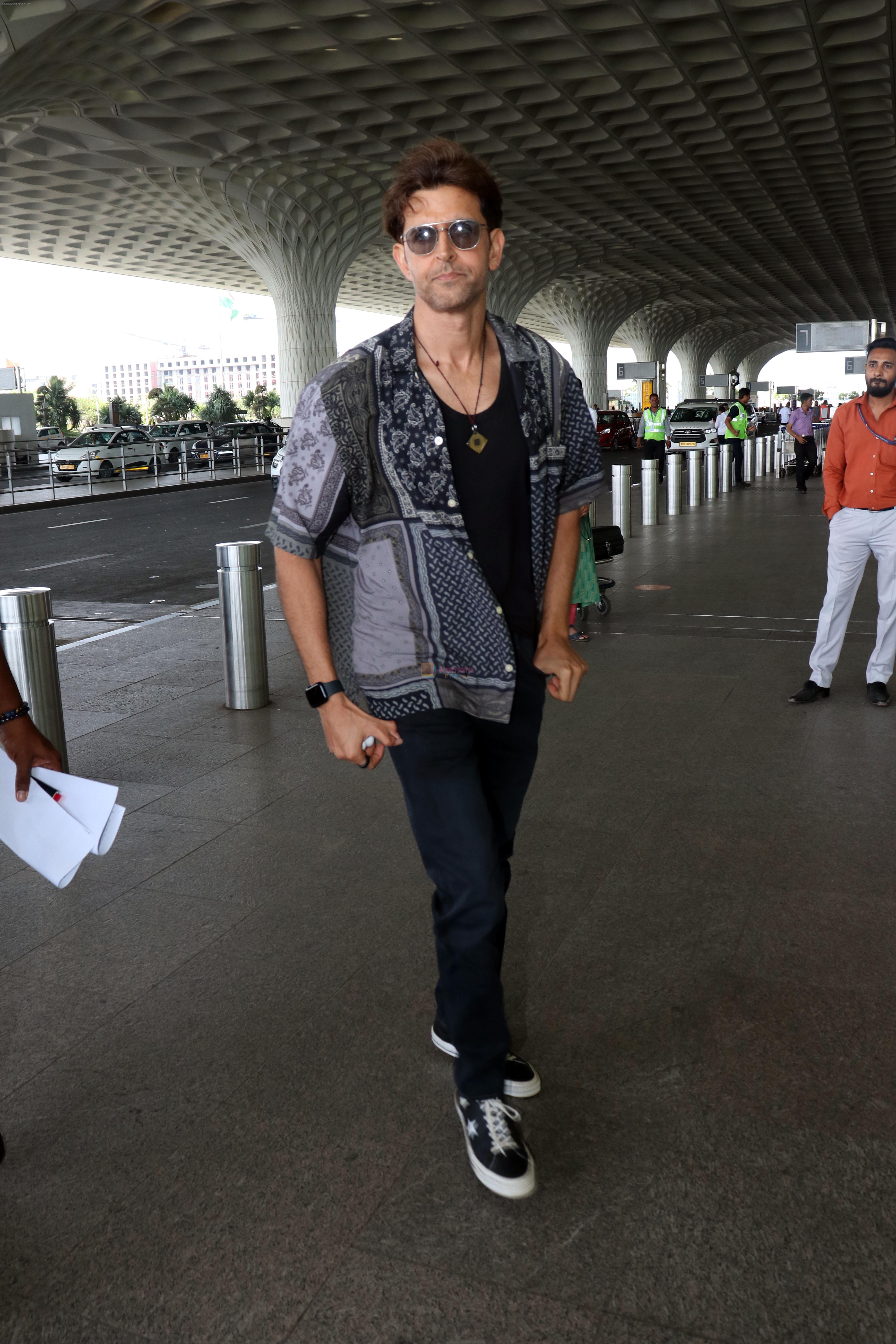 Hrithik Roshan in black teas unbuttoned shirt dark blue jeans and Converse Cons One Star Pro OX Shoes