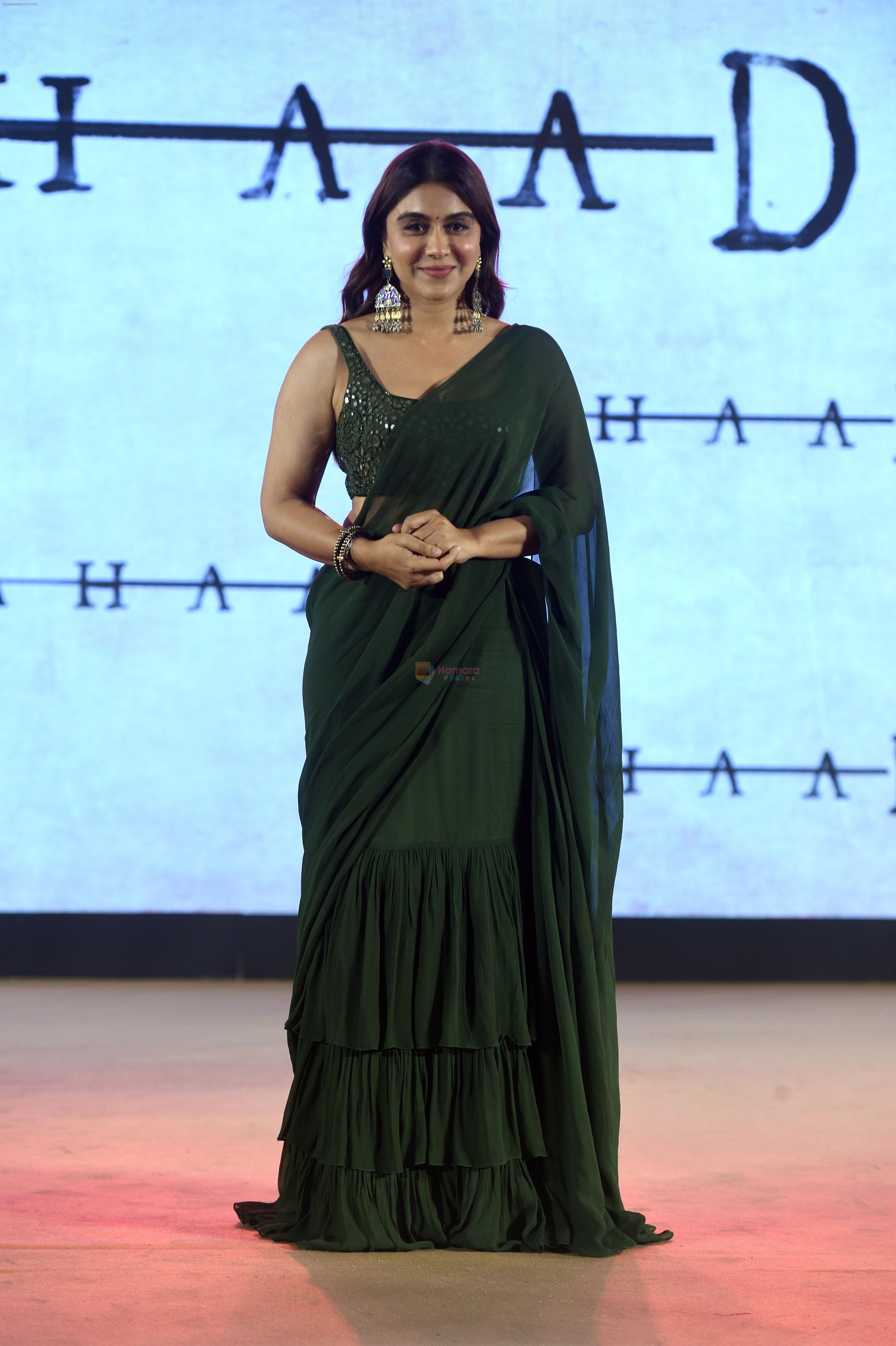 Zoa Morani seen in a green tiered sari from Arpita Mehta paired with simple silver earrings and a kada at the trailer launch oF Film Dahaad on 3 May 2023